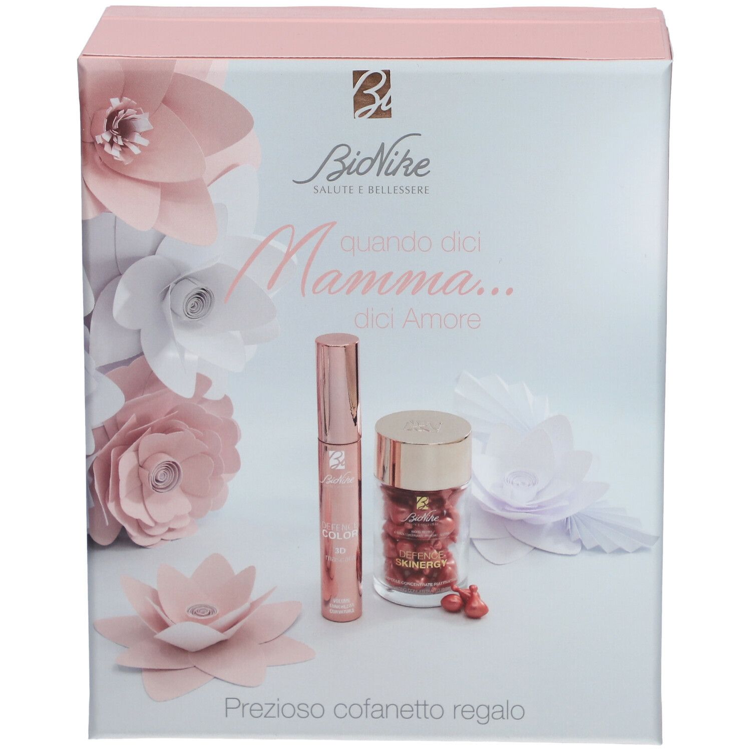 Confezione regalo rosa BioNike con prodotti e fiori di carta. Scritta: Prezioso cofanetto regalo. Contiene prodotti.