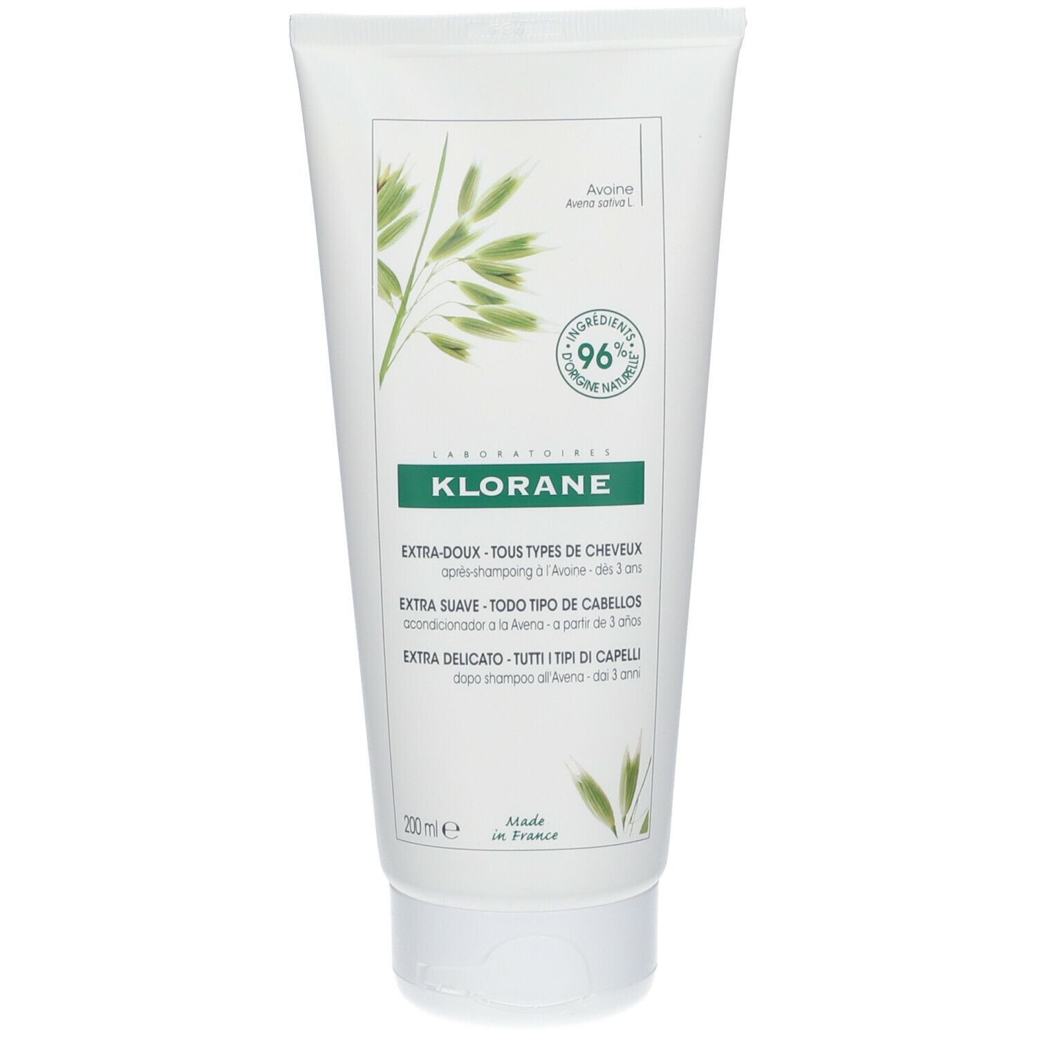 Tubo bianco con etichetta verde. Testo: Klorane, Extra-Doux, 96% ingredienti naturali. Cura dei capelli.