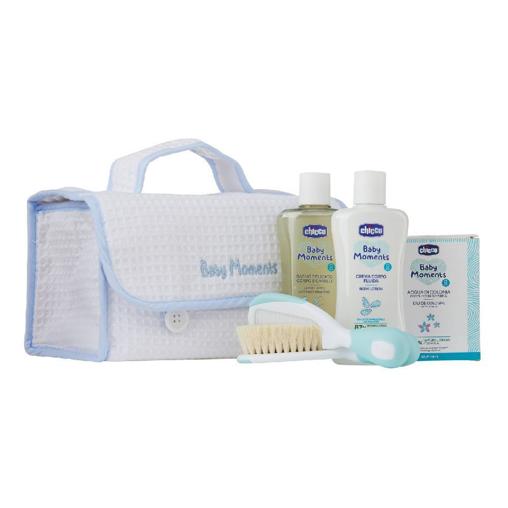 Borsa per la cura del bambino bianca e blu con prodotti. Include: bottiglie, spazzola, sapone. Scritta: Baby Moments, Chicco.