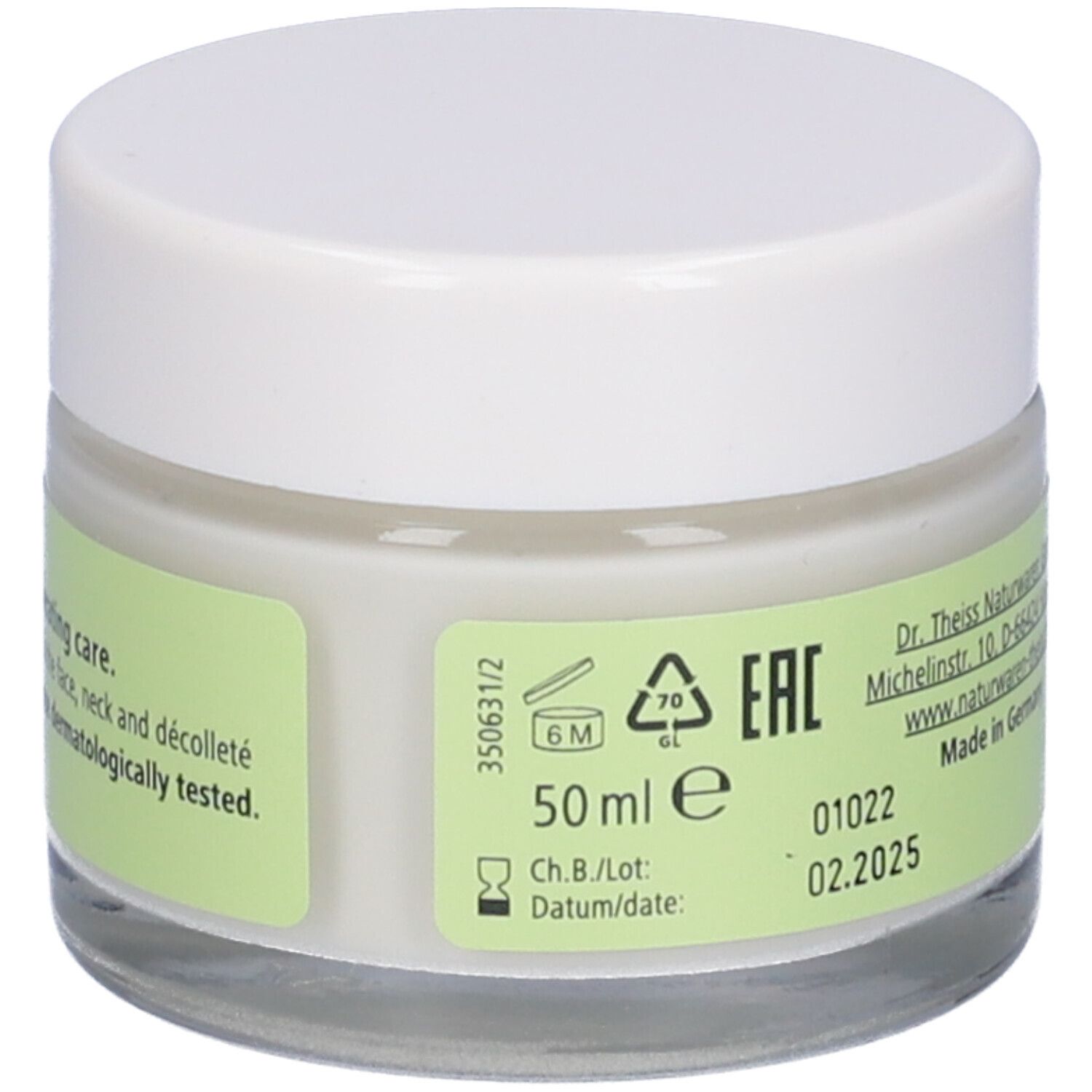 Creme-Glas mit weißem Deckel. Etikett mit 50 ml, Chargennummer und Verfallsdatum. EAN-Zeichen.