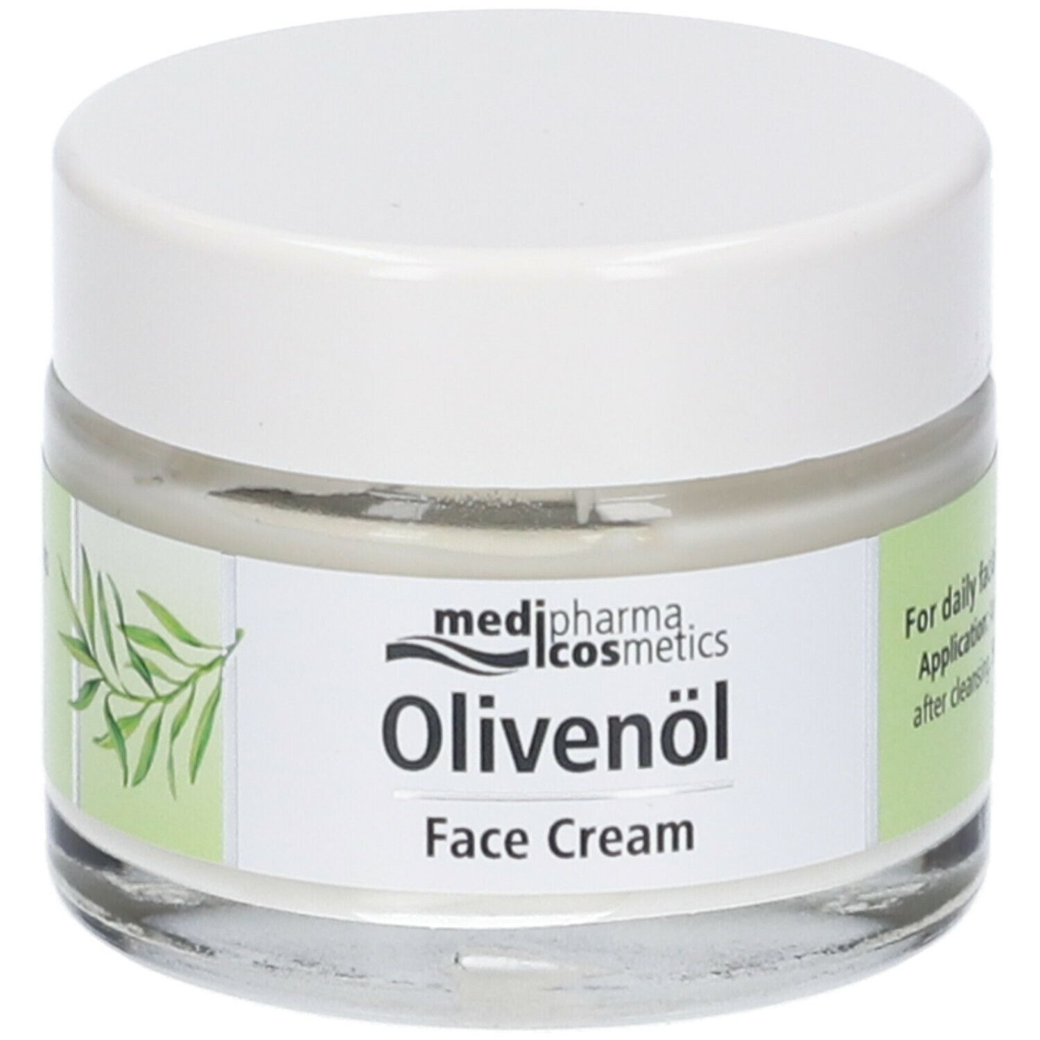 Crema viso Medipharma Olivenöl in un vasetto di vetro con coperchio bianco. Nome del prodotto e ramo d'ulivo.