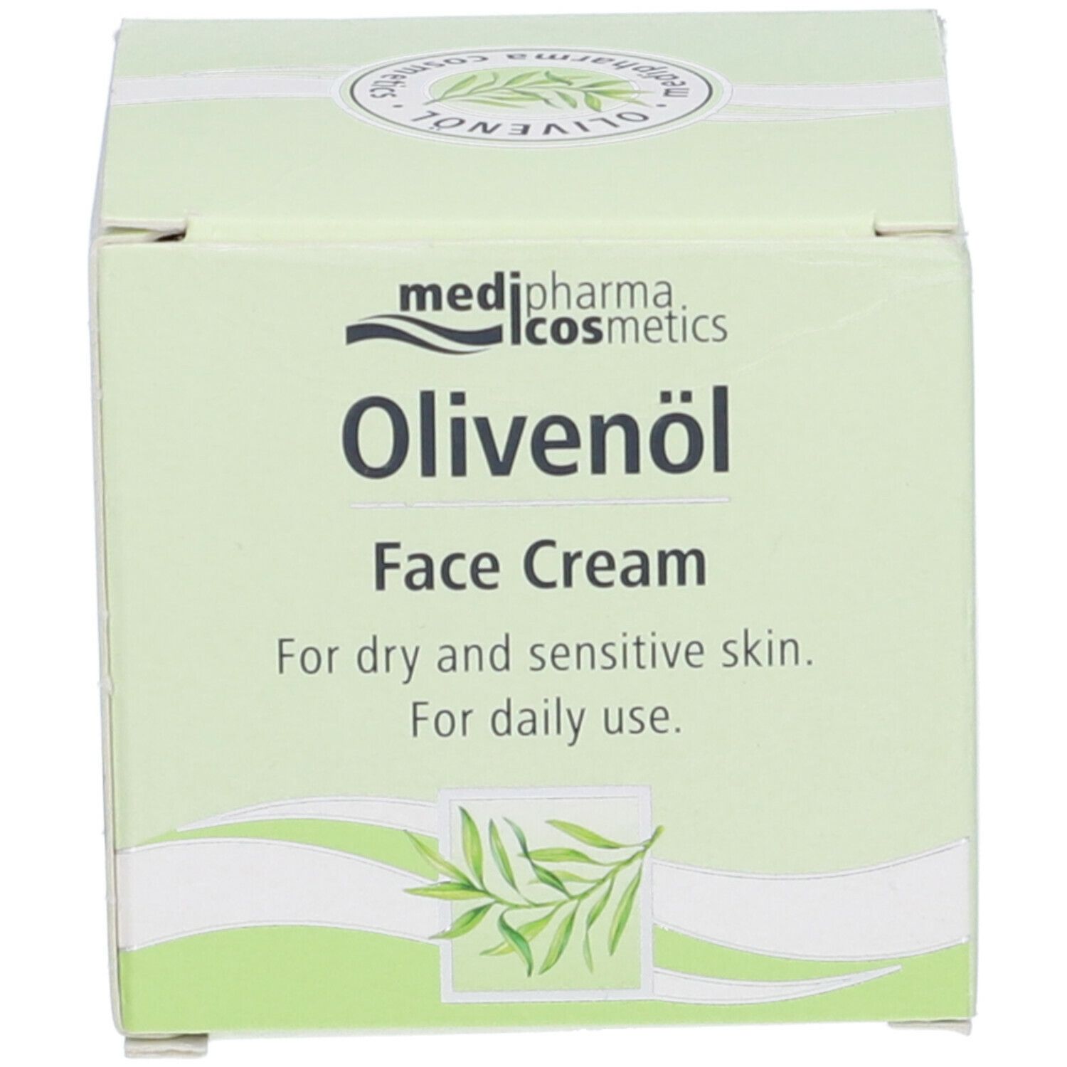 Crema viso Medipharma Olivenöl. Scatola con nome del prodotto e illustrazione di ramo d'ulivo. Per pelli secche e sensibili.