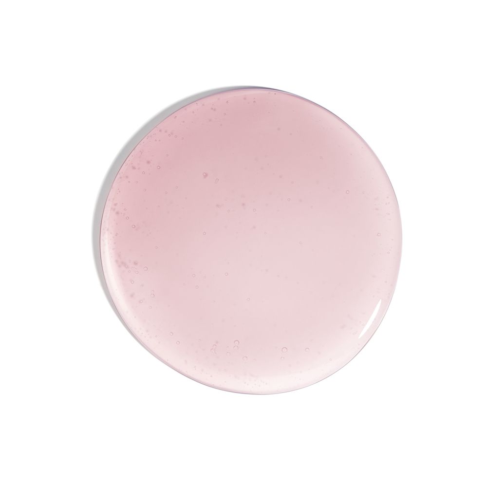 Liquido rosa. Circolare. Sfondo: bianco.