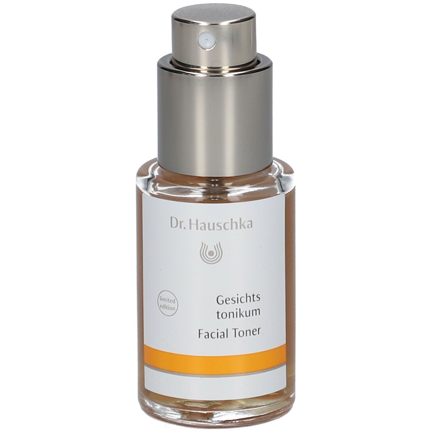 Flacone in vetro con vaporizzatore. Scritta: Dr. Hauschka. Etichetta con nome del prodotto.