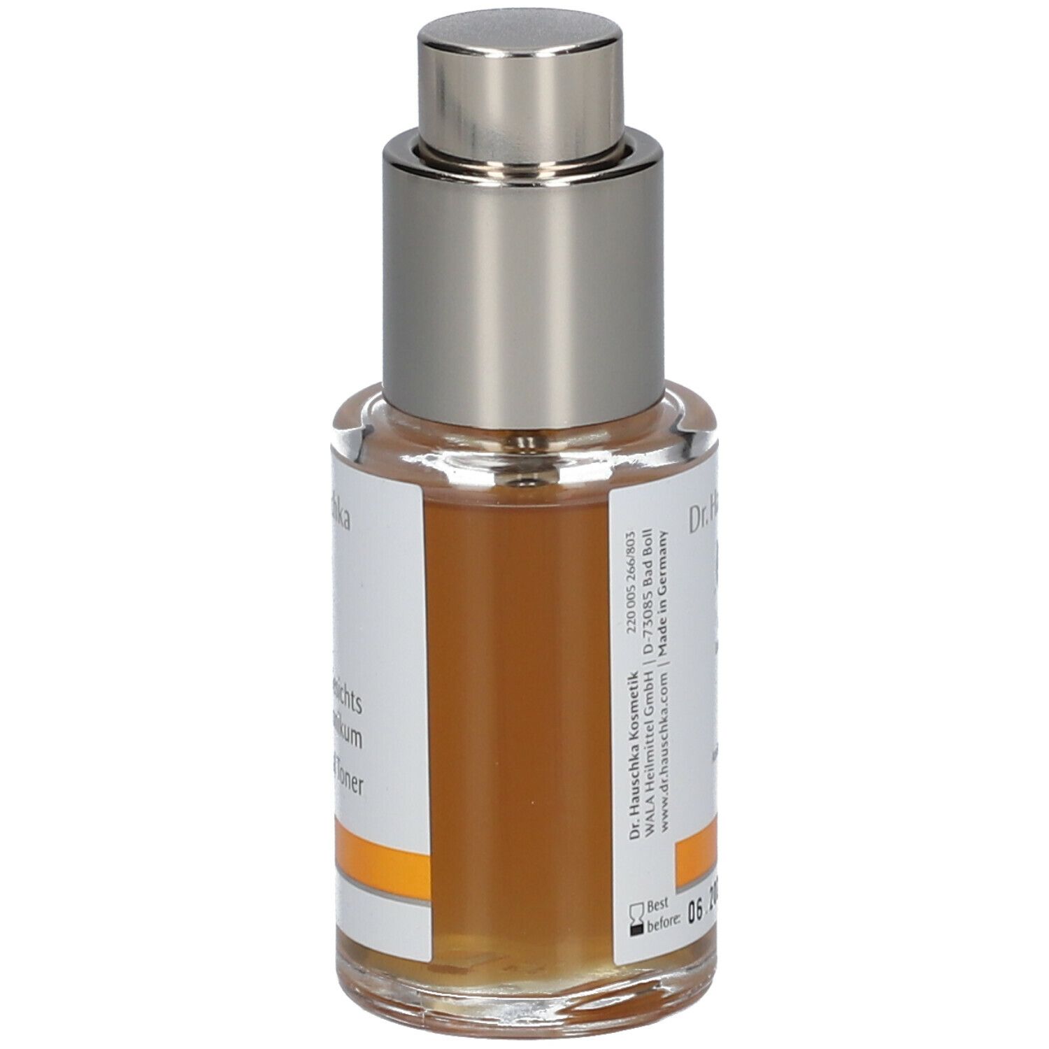 Flacone in vetro con vaporizzatore. Scritta: Dr. Hauschka. Etichetta con nome del prodotto.