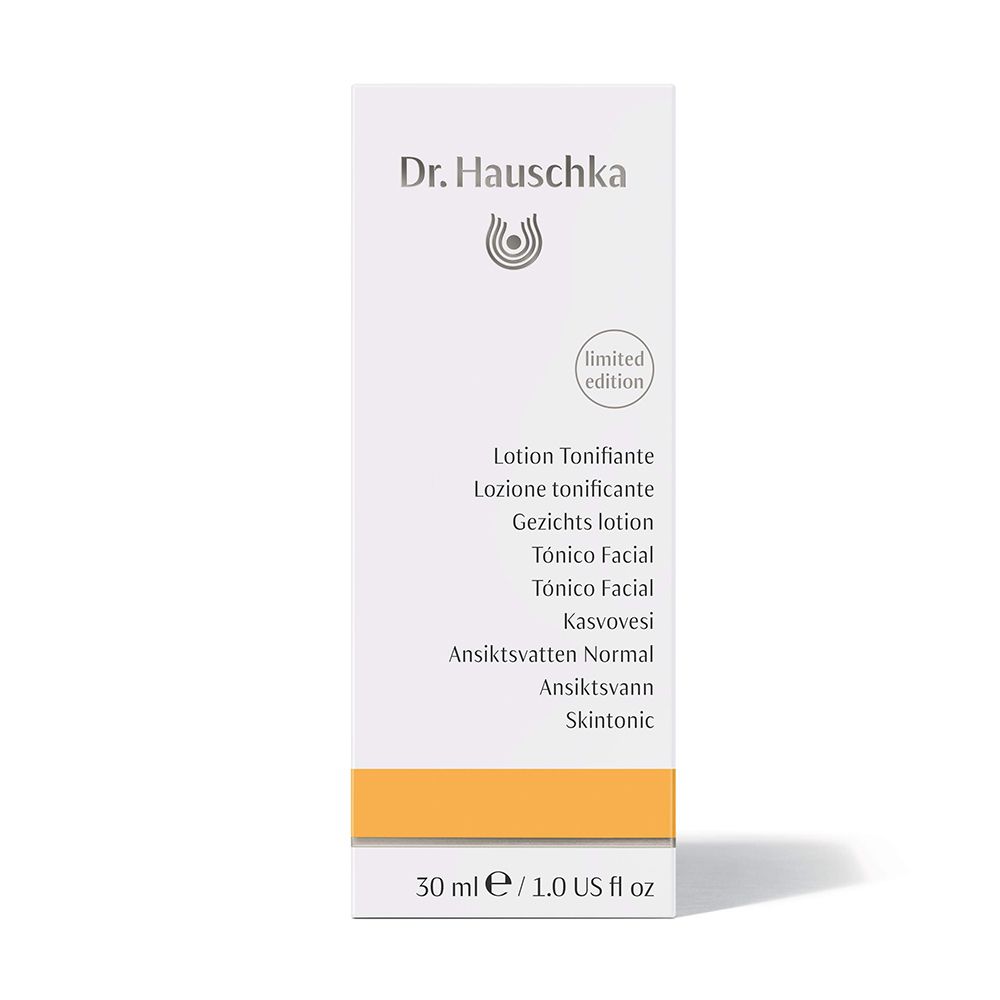 Confezione in cartone con nome del prodotto e logo. Scritta: Dr. Hauschka. Striscia arancione in basso.