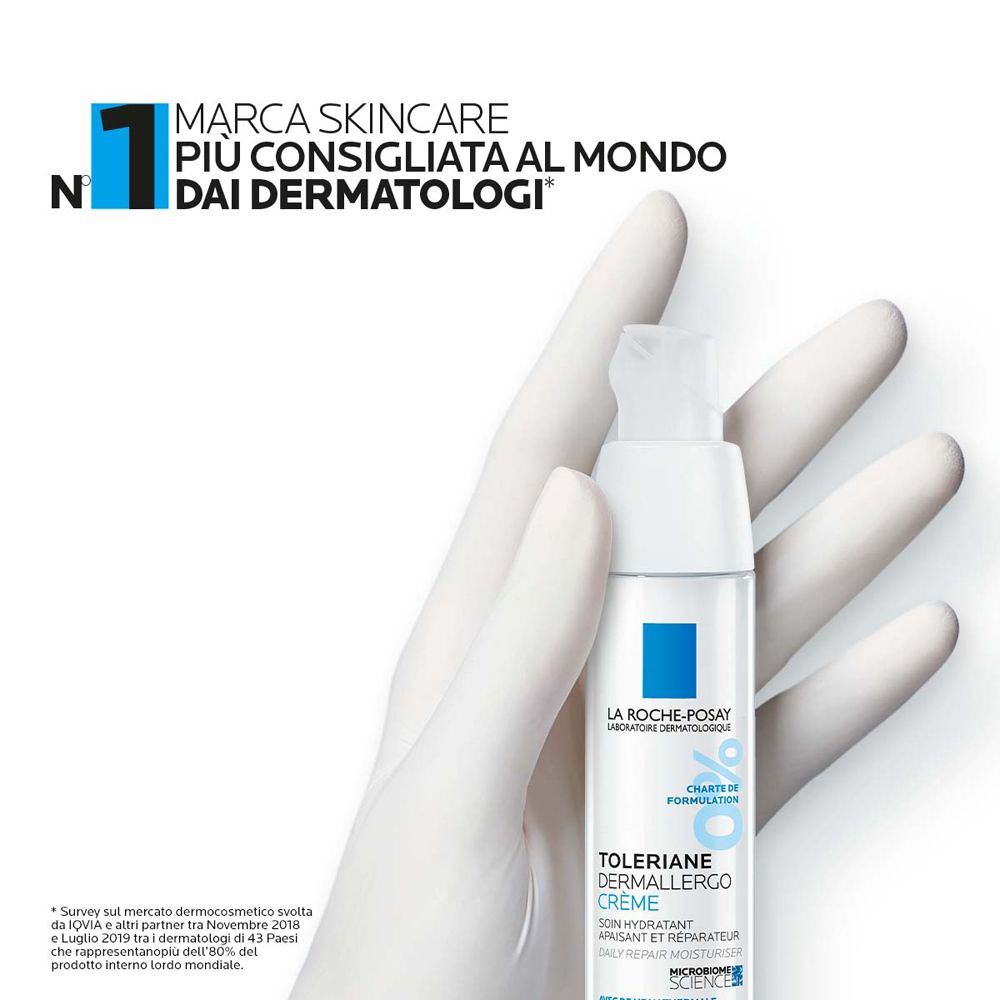 Mano bianca che tiene un flacone. Scritta: Toleriane Dermallergo Crema. N°1 marchio skincare, consigliato dai dermatologi.