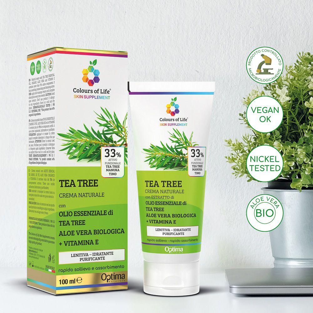 Colours of Life Kreme TEA TREE Verpackung und Tube, mit Siegeln und Pflanze.