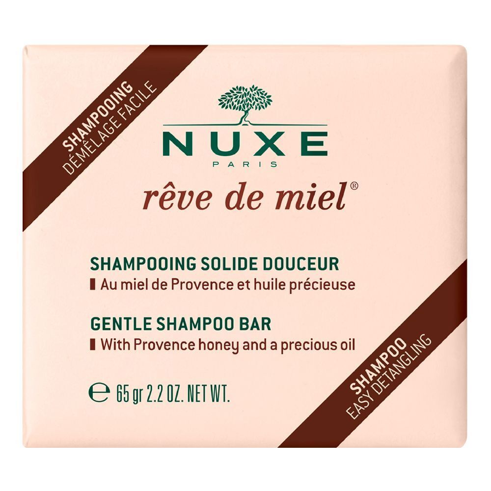 Shampoo solido. Forma quadrata, rosa chiaro. Scritte: Nuxe, rêve de miel, Shampooing Solide Douceur, 65 gr.