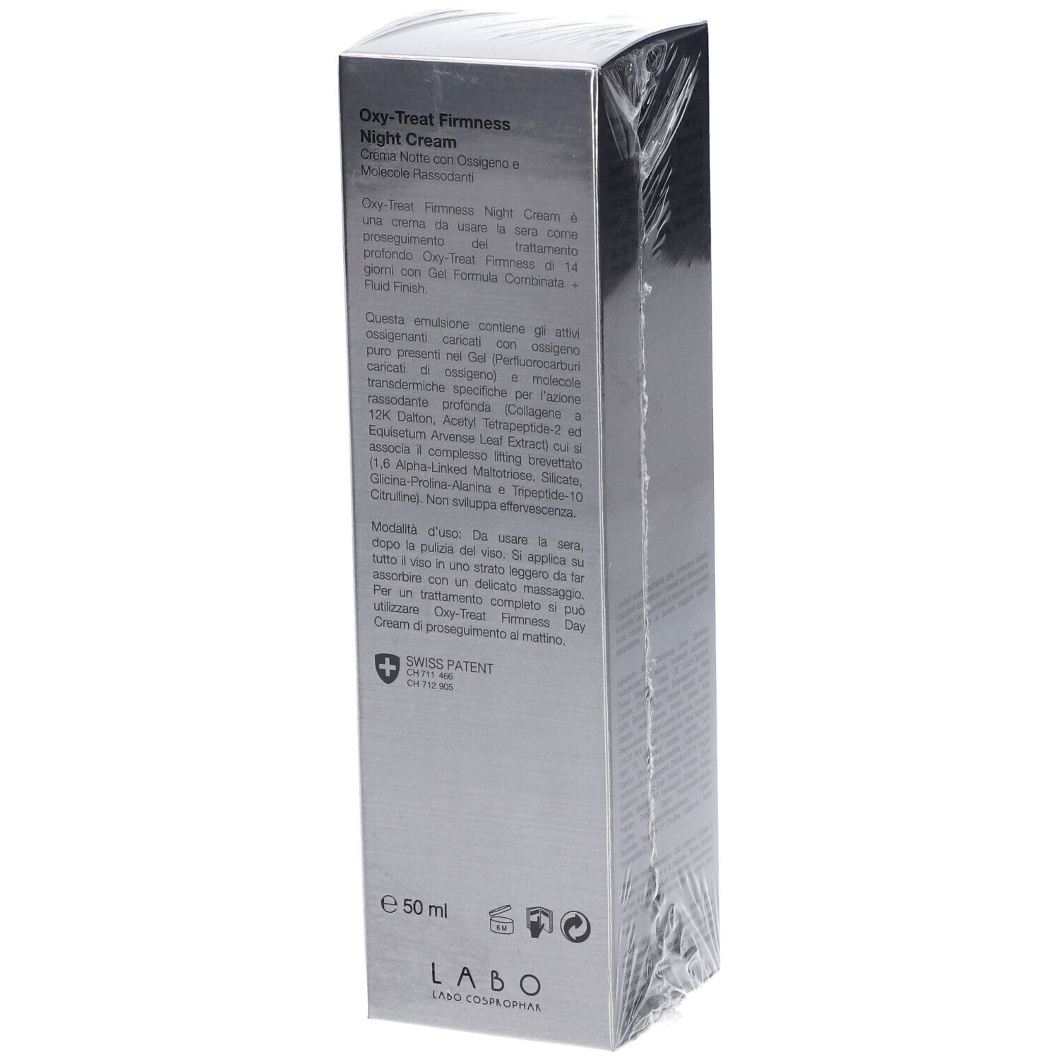 Lato della confezione della crema notte Oxy-Treat Firmness. Testo multilingue. Logo Swiss Patent. Confezionato in pellicola.