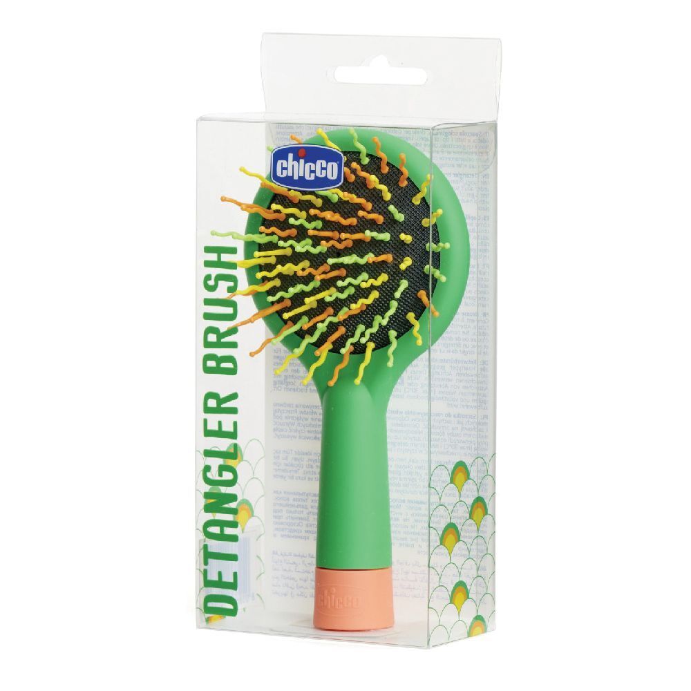Spazzola verde con setole arancioni e gialle. In confezione trasparente. Marchio Chicco.