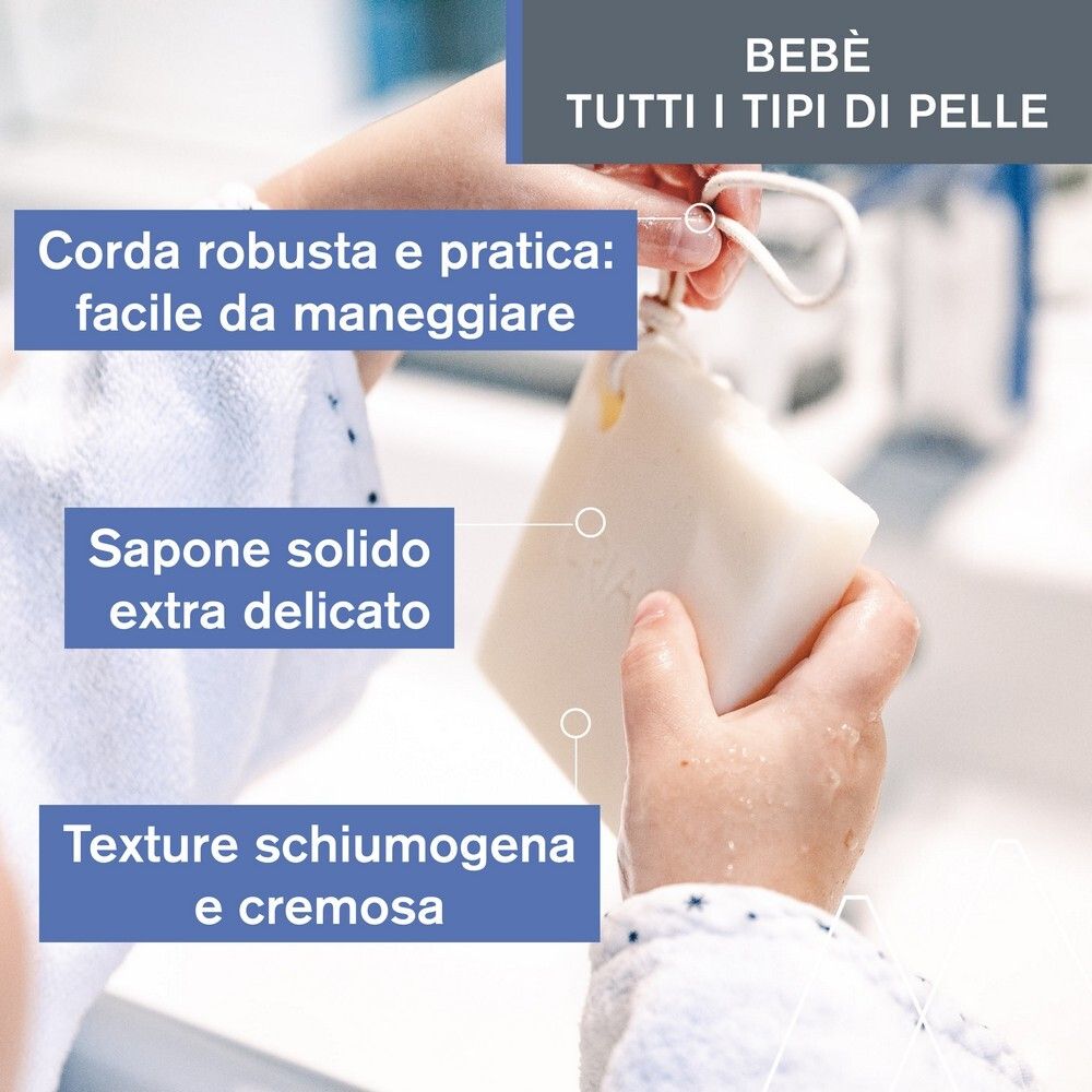 Mani che tengono sapone solido. Testo: Corda robusta, sapone solido extra delicato, texture schiumogena e cremosa.
