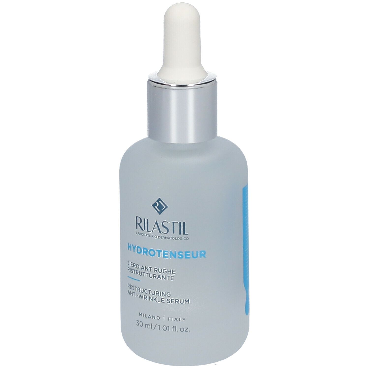 Siero Rilastil Hydrotenseur. Flacone con pipetta. Flacone in vetro blu chiaro opaco. Tappo argentato. Nome del prodotto e logo.