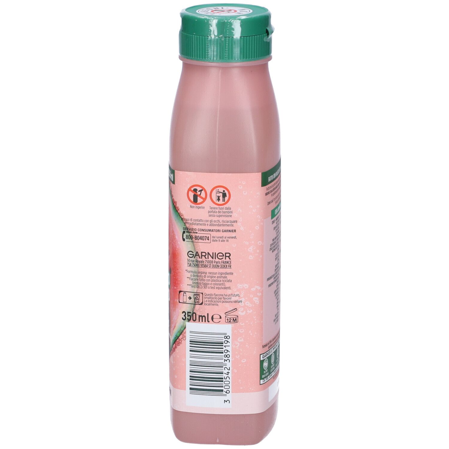 Retro di un flacone di shampoo rosa con tappo verde. Testo: Garnier Fructis, Shampoo Hair Food Anguria. Informazioni sugli ingredienti e il riciclo.