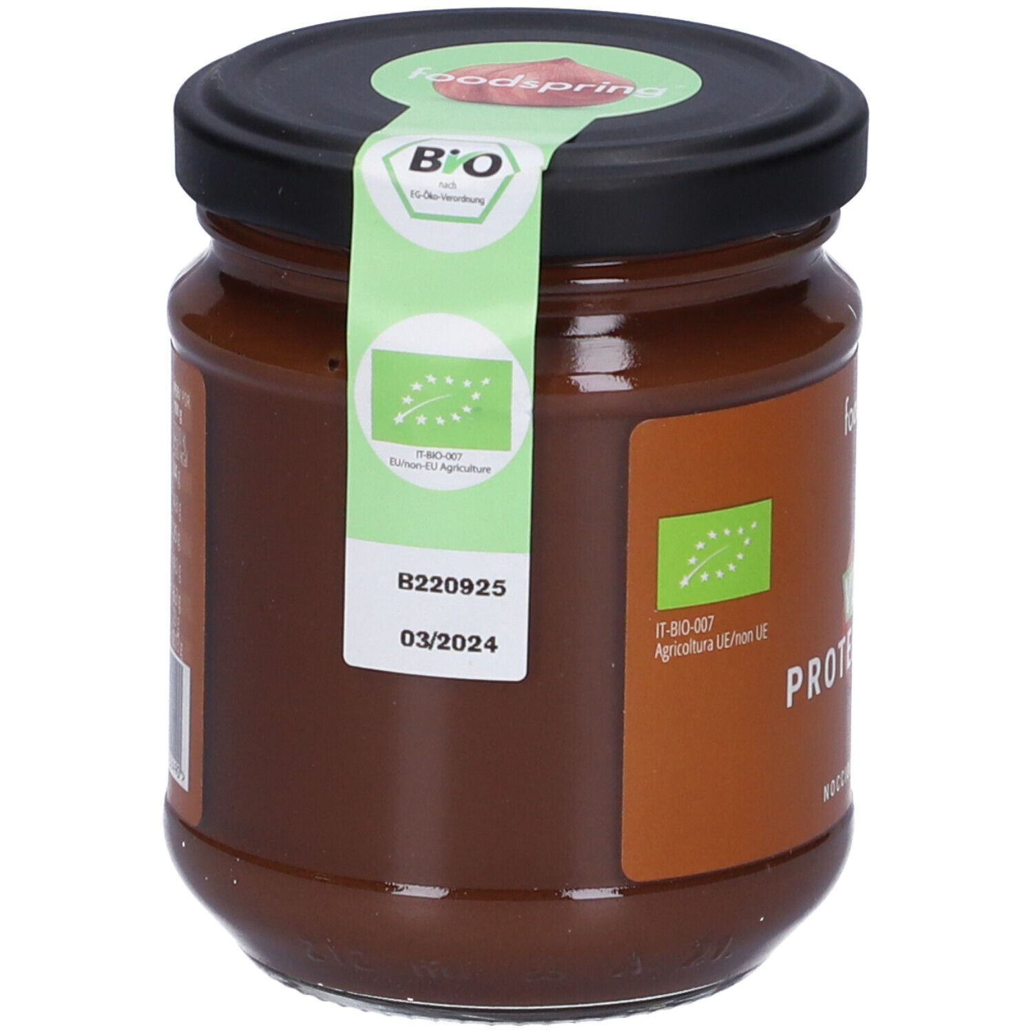 Vasetto Foodspring Bio Crema Proteica Vegana Alla Nocciola. Retro con elenco ingredienti. Coperchio con sigillo verde ed etichetta.