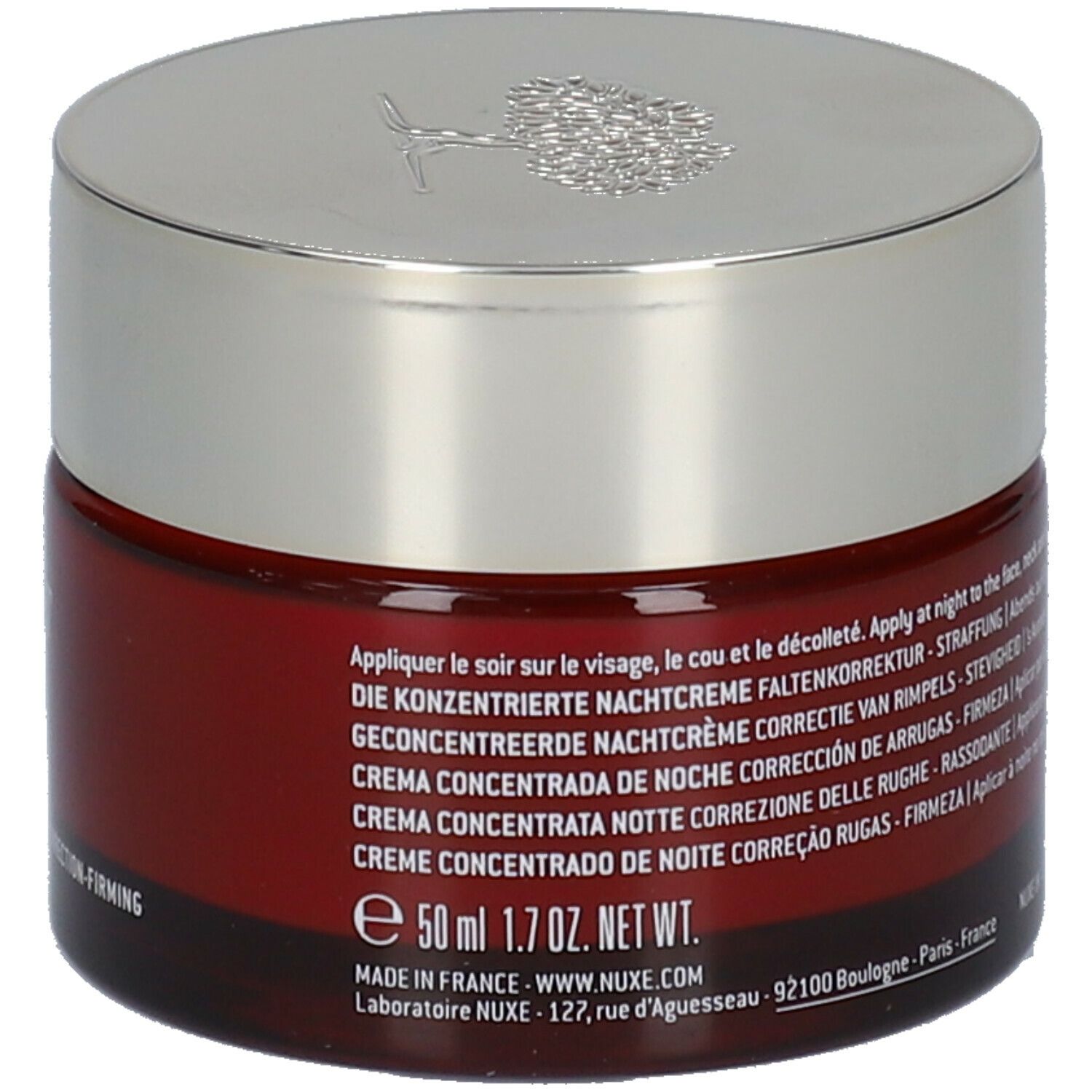 Vaso di crema rosso scuro con coperchio argentato. Scritta: 50 ml, 1.7 OZ. NET WT. Testo multilingue.