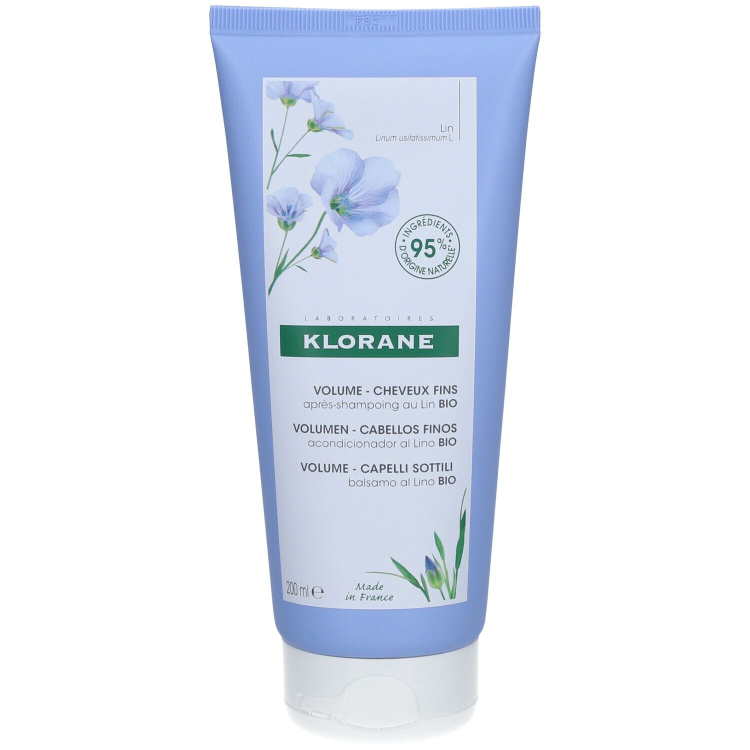 Tubo blu chiaro Klorane. Scritta: Volume, capelli fini. Ingredienti bio. Fiori di lino. 95% ingredienti naturali.