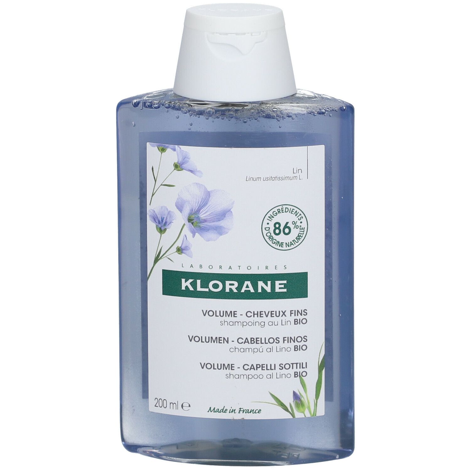 Flacone di shampoo blu con tappo bianco. Scritta Klorane, shampoo volume, 86% naturale.