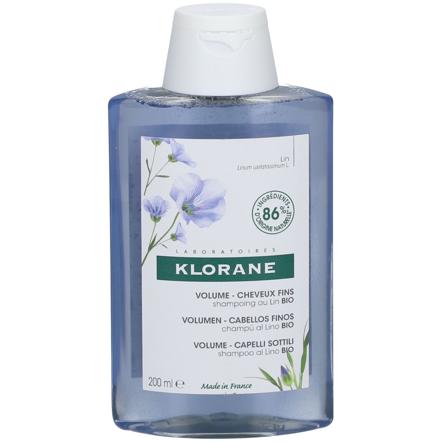 Flacone di shampoo blu con tappo bianco. Scritta Klorane, shampoo volume, 86% naturale.