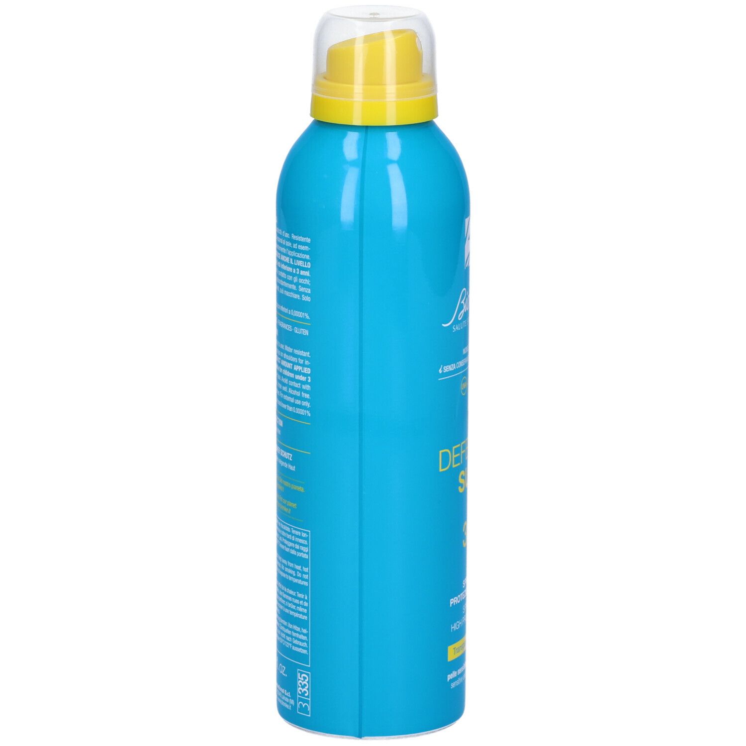 Flacone spray blu turchese, vista laterale. Erogatore giallo. Scritta: Defence Sun. Testo in italiano.