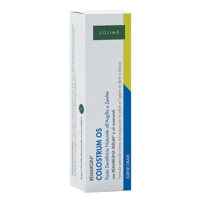 Confezione di dentifricio bianca con dettagli verdi e blu. Testo: Remargin Colostrum OS, Pasta Dentifricia Naturale, Solimé.