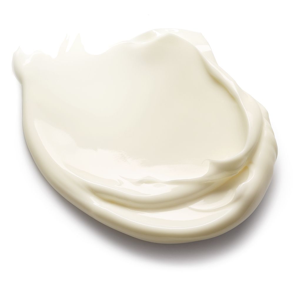 Macchia di burro corpo bianco cremoso. Superficie liscia con leggere ondulazioni.