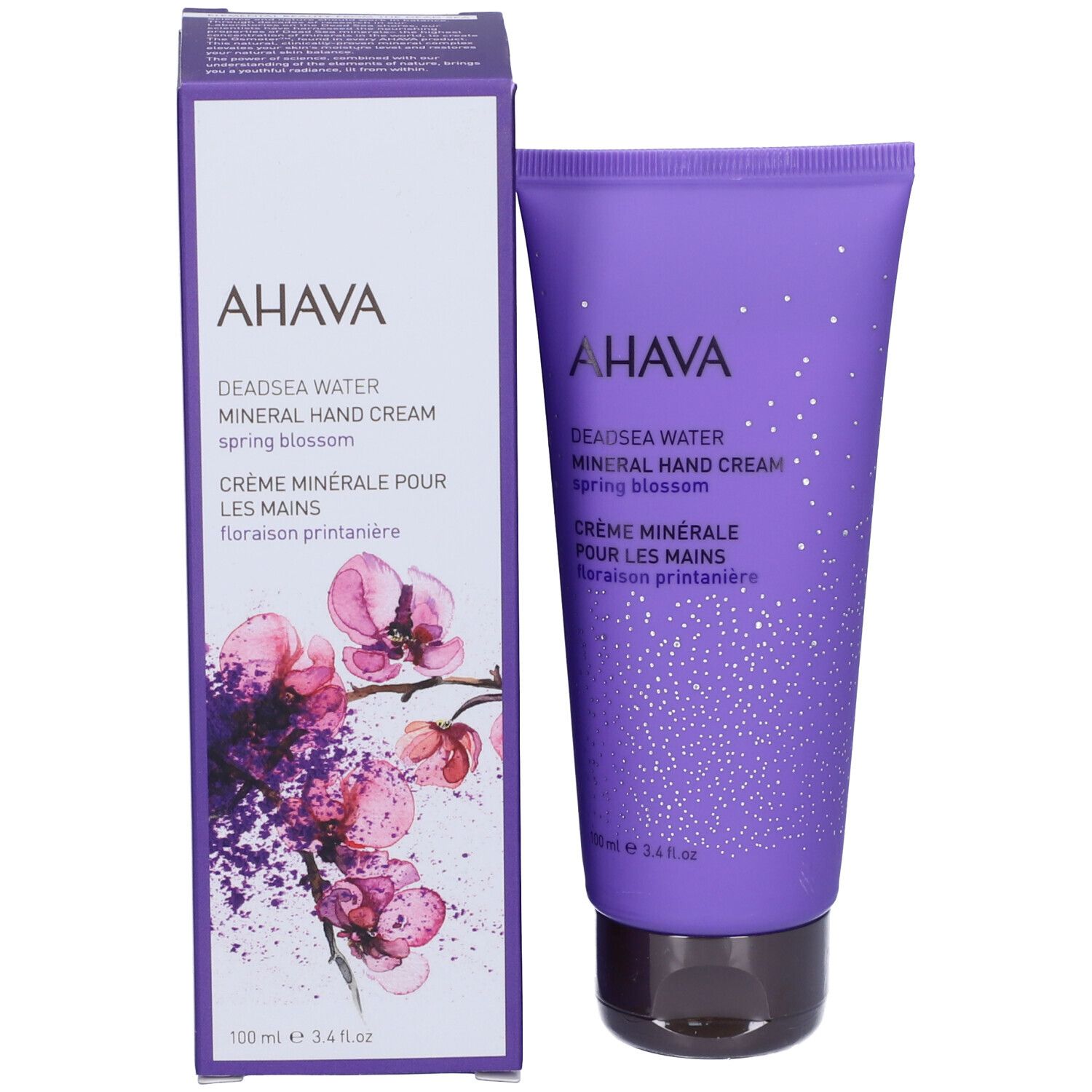 Crema mani AHAVA e scatola. Scritta: Deadsea Water Mineral Hand Cream Spring Blossom. Lilla e bianco.