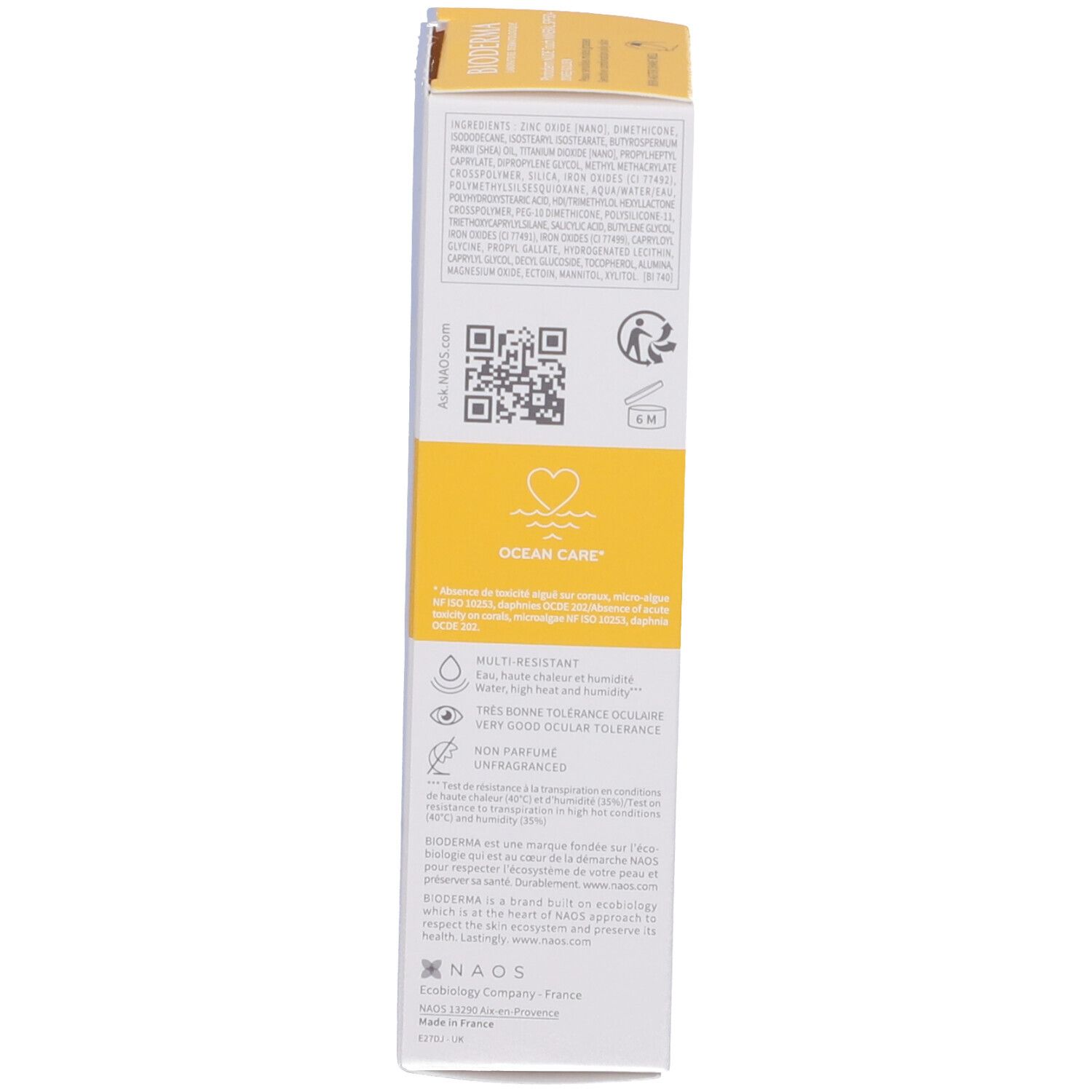Lato della confezione della crema solare. Testo con ingredienti, QR code, logo Ocean Care. Informazioni sulla tolleranza.