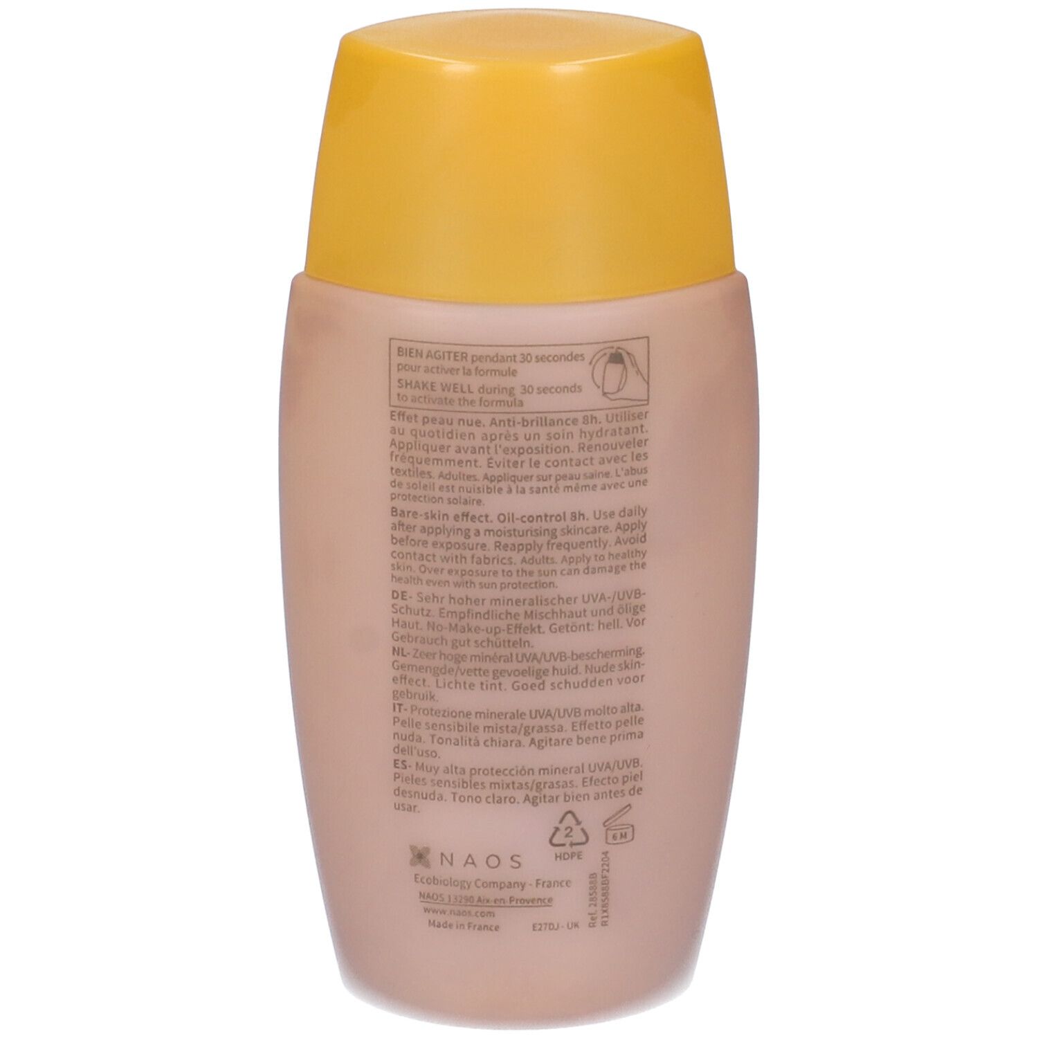 Retro di un flacone beige con tappo giallo. Informazioni testuali, inclusi ingredienti e istruzioni per l'uso.