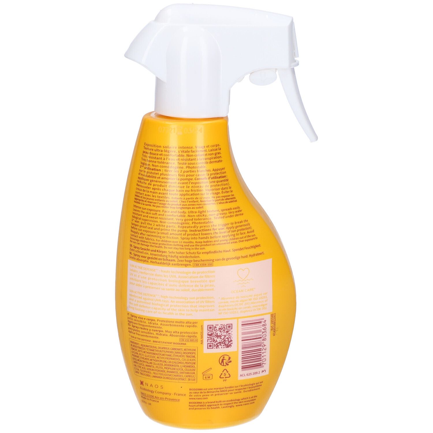 Flacone giallo con erogatore bianco. Retro con testo e codice a barre. Scritta illeggibile.
