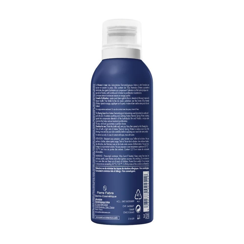 Retro di un flacone blu con testo. Contiene informazioni su ingredienti, uso e produttore. Con codice a barre e simboli di riciclaggio.