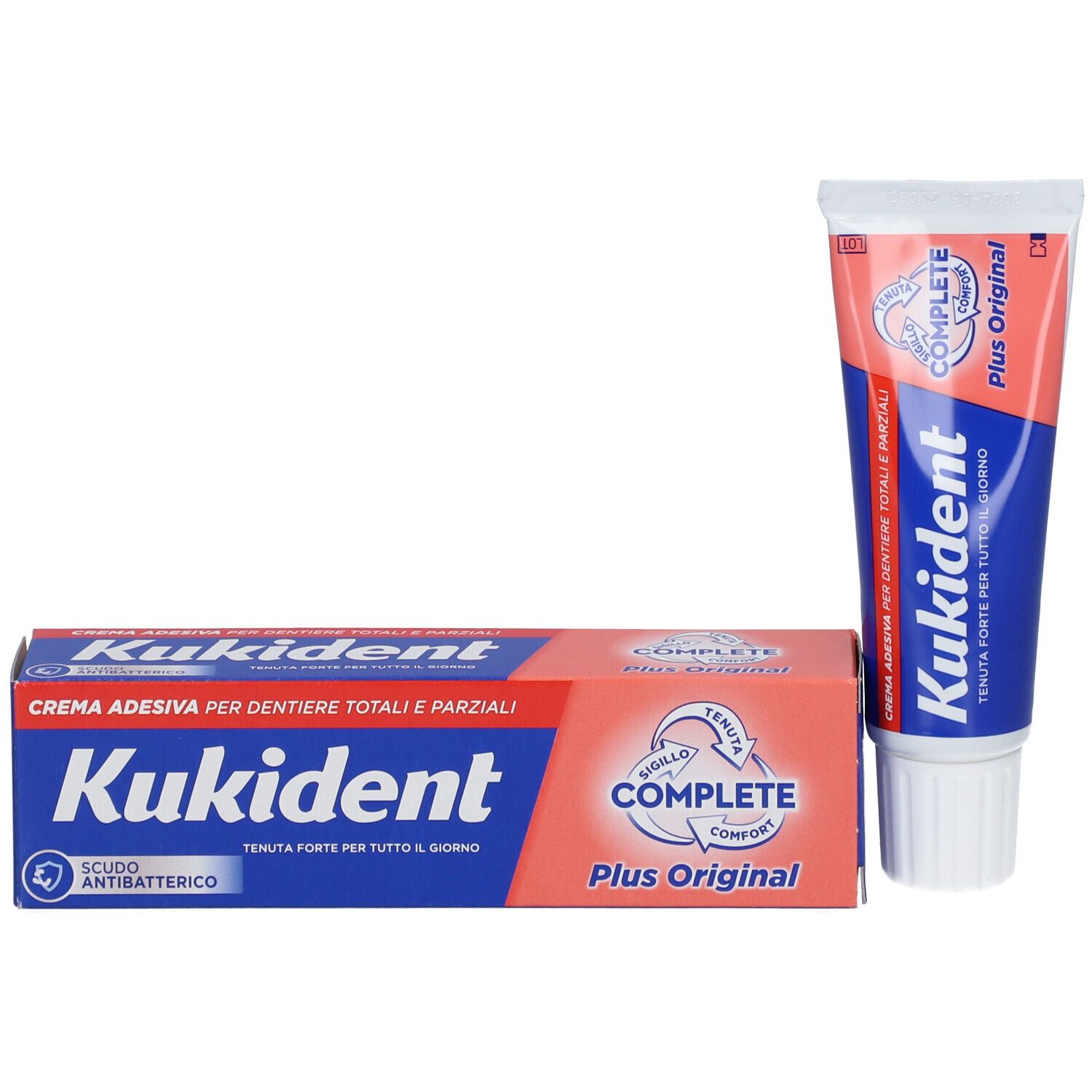 Tubo e scatola di crema adesiva. Scritto: Kukident, Complete Plus Original. Crema per protesi totali e parziali.