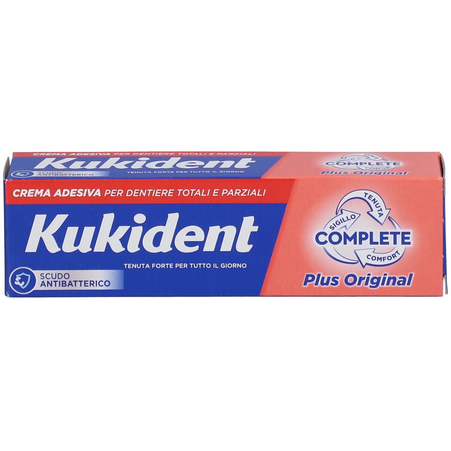 Scatola con scritta blu e rossa. Scritto: Kukident, Complete Plus Original. Crema per protesi totali e parziali.