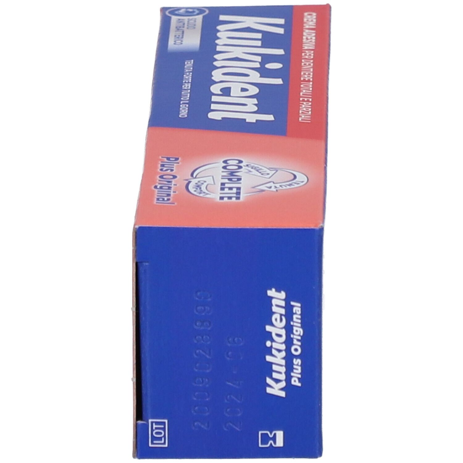 Scatola, blu e rossa. Scritto: Kukident, Complete Plus Original. Numero di lotto e data di scadenza.