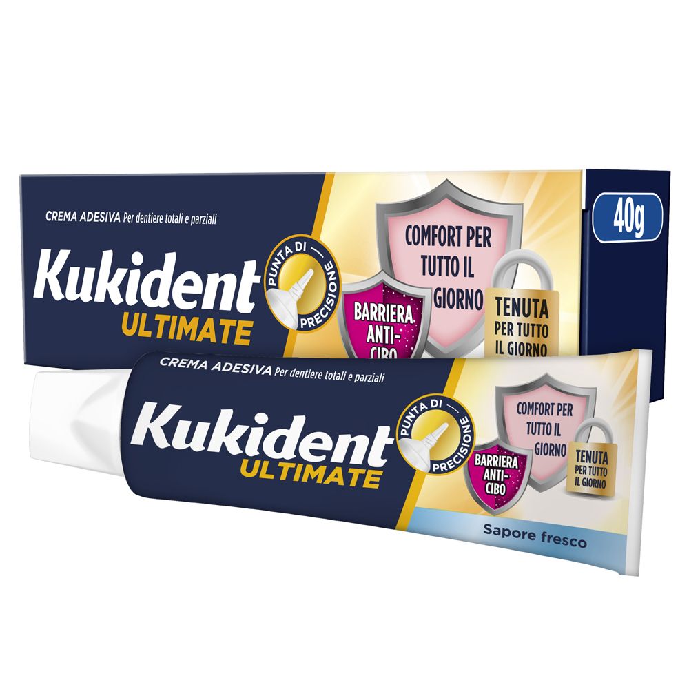 Tubo e confezione di crema adesiva. Kukident Ultimate, confezione blu, 40g. Scritta: Barriera Anti-cibo, Comfort per tutto il giorno.