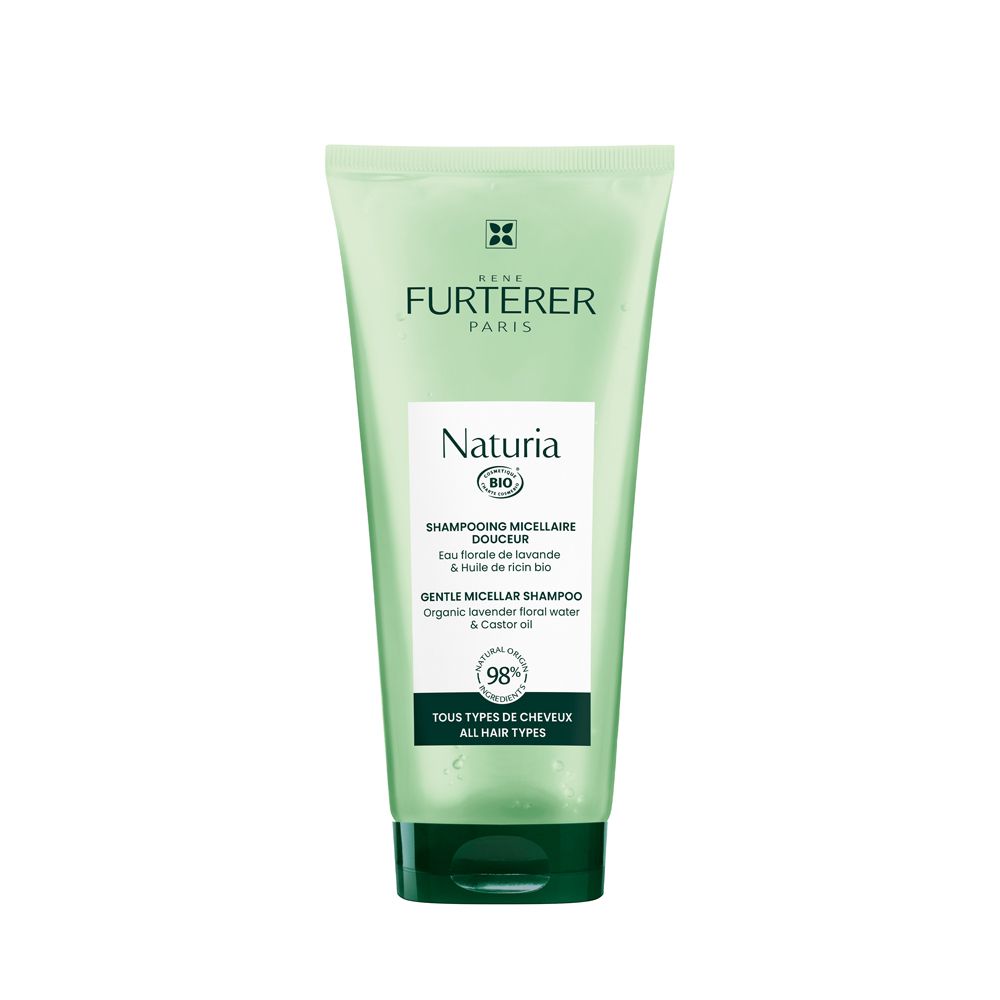 Tubo verde con etichetta bianca. Testo: René Furterer, Naturia, shampoo micellare delicato. Tutti i tipi di capelli.