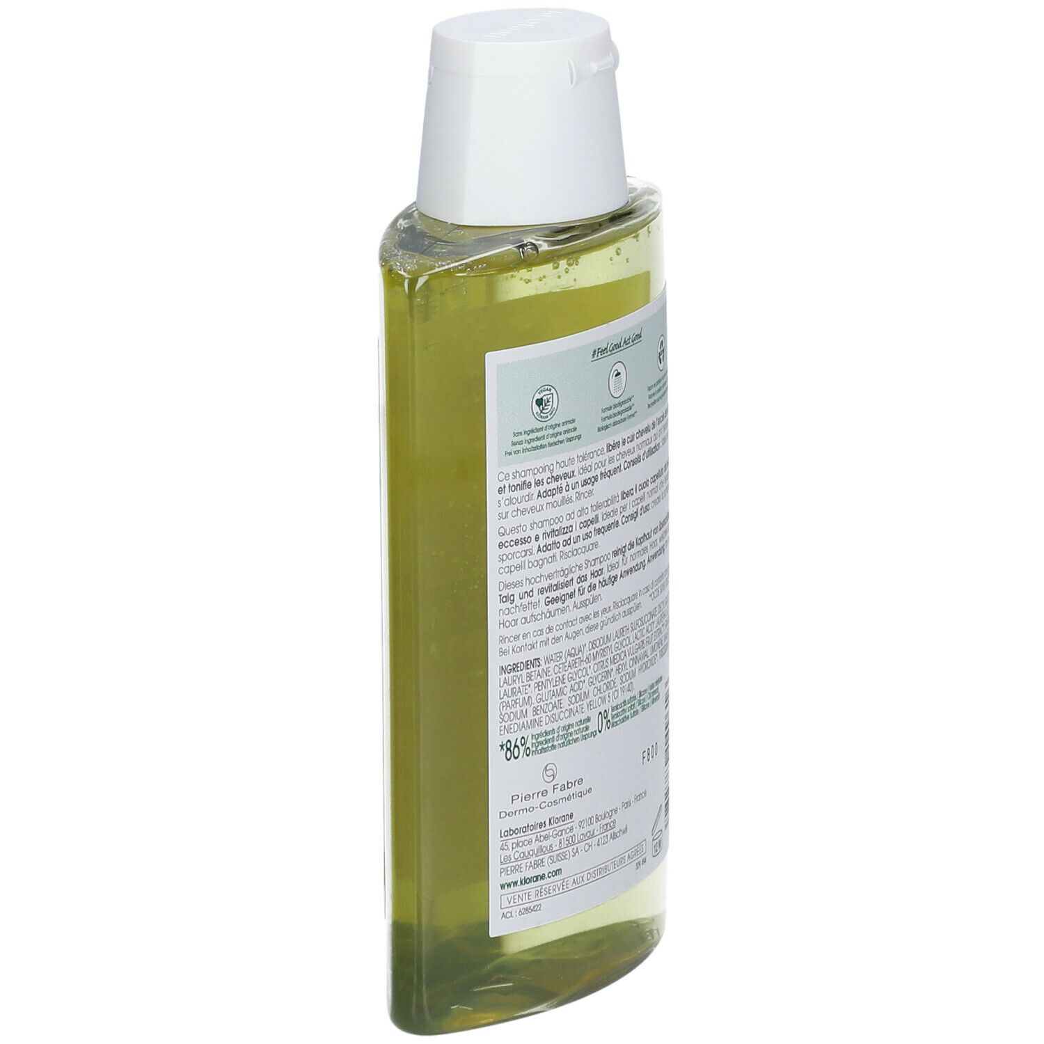Retro del flacone di shampoo Klorane inclinato. Informazioni testuali e loghi. Simboli di riciclo e ambientali.