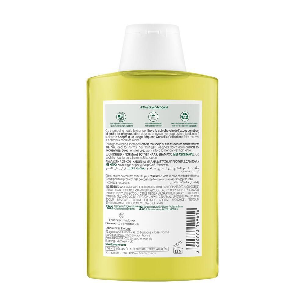 Retro del flacone di shampoo Klorane. Informazioni testuali multilingue. Simboli di riciclo e ambientali.