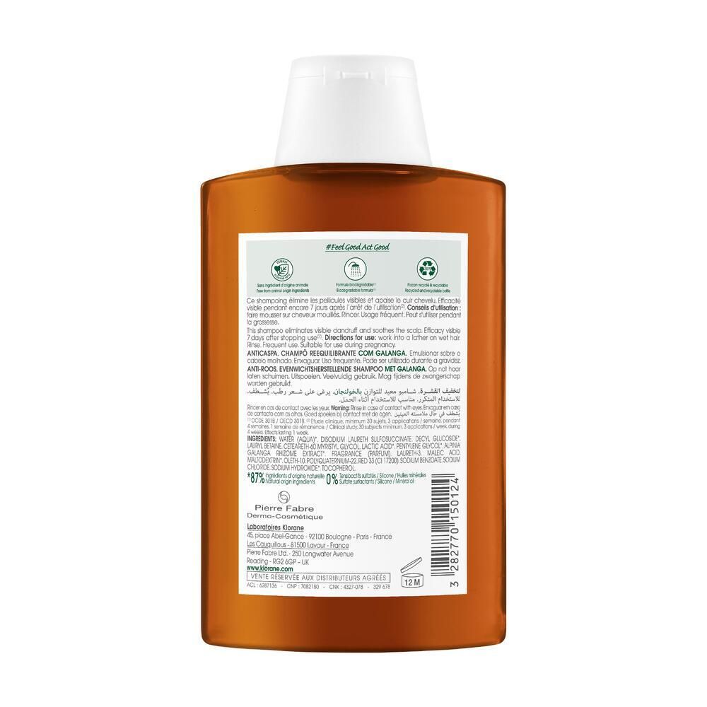 Rückseite einer braunen Shampoo-Flasche mit weißem Deckel. Text und Logos. 12M-Symbol.