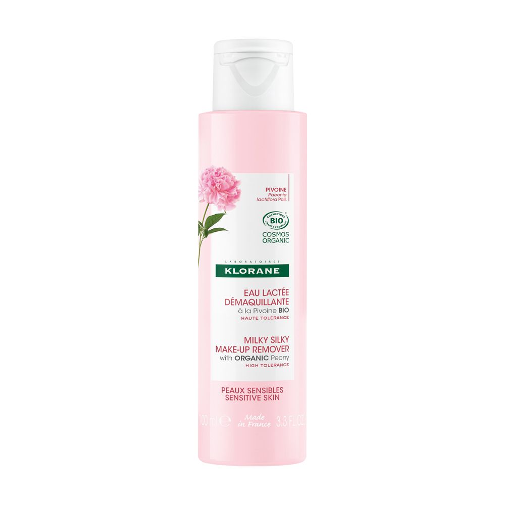 Flacone rosa con tappo bianco. Prodotto Klorane con fiore di peonia e testo. Certificazione bio.