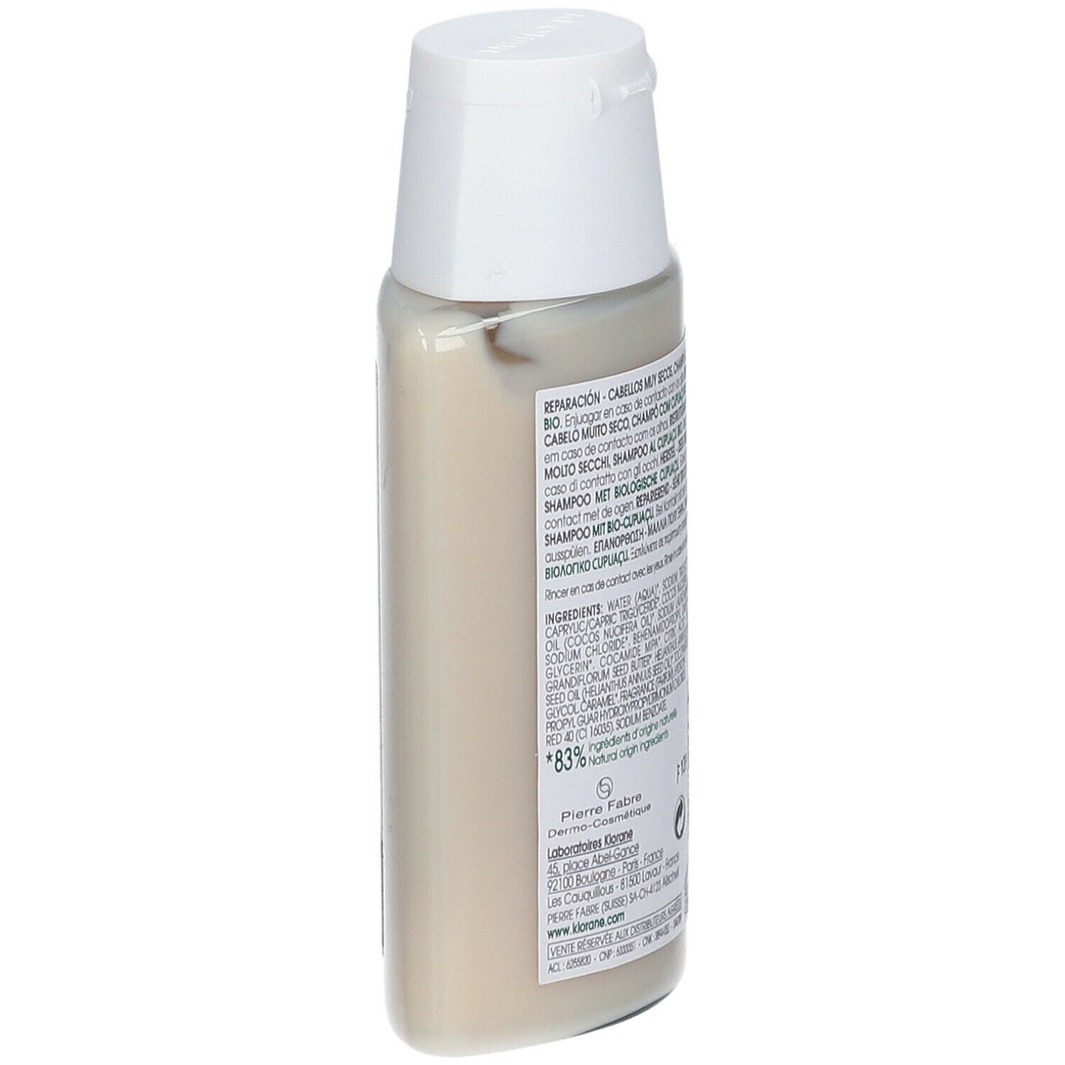 Retro del flacone di shampoo Klorane. Testo multilingue. 83% ingredienti di origine naturale.