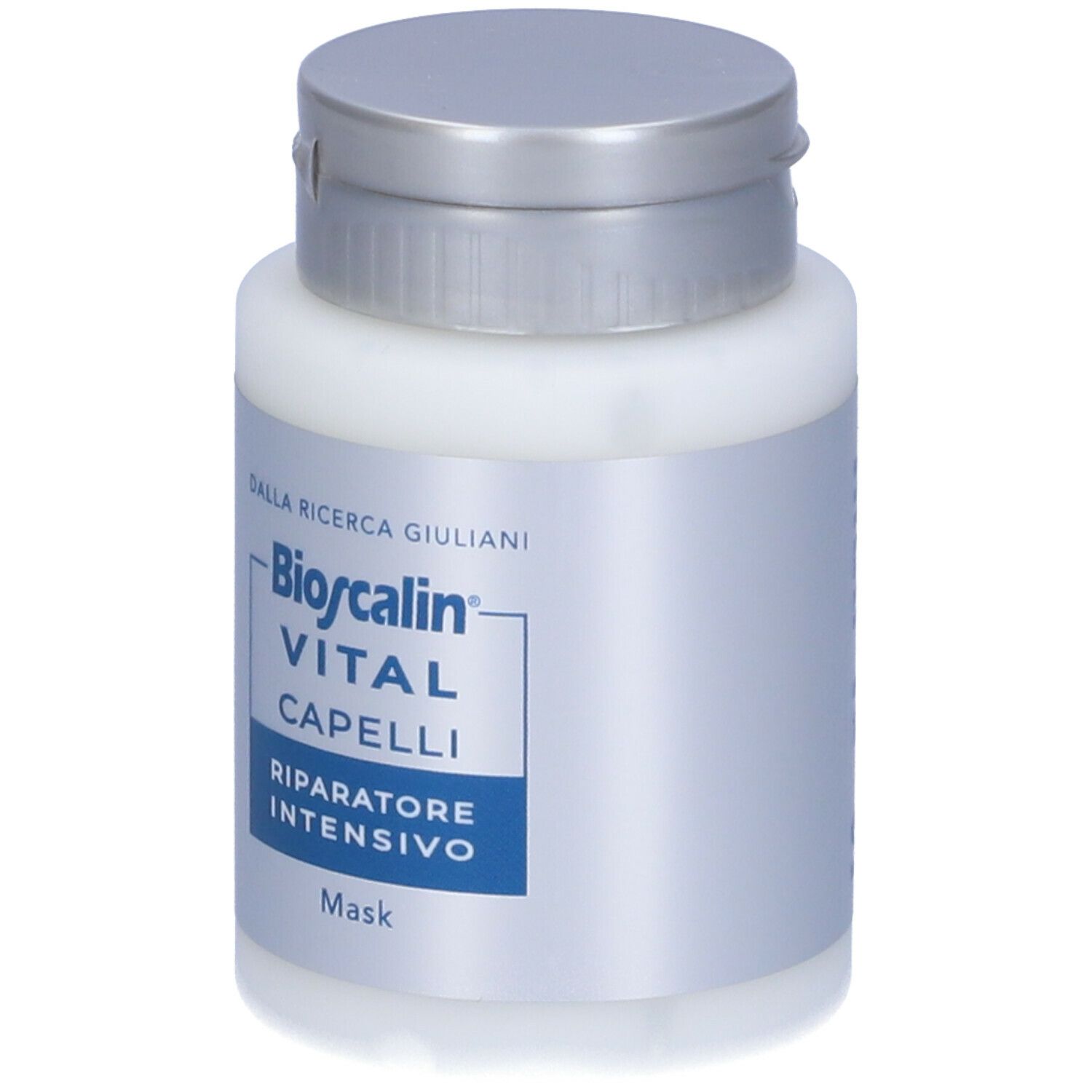 Prodotto bianco con tappo argentato. Scritta: Bioscalin VITAL CAPELLI Riparatore Intensivo.