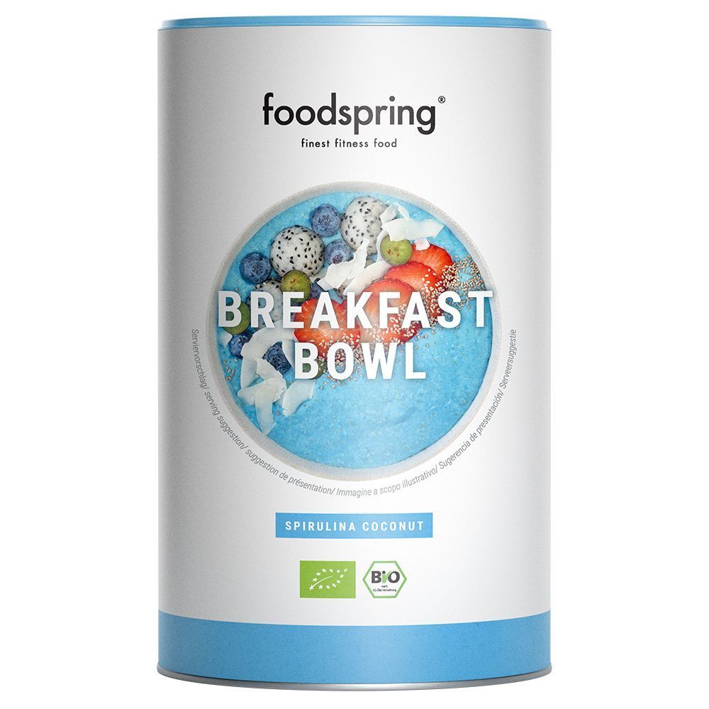 Barattolo cilindrico con logo "Foodspring" e illustrazione "Breakfast Bowl". Scritta "Spirulina Coconut" ed etichetta biologica.