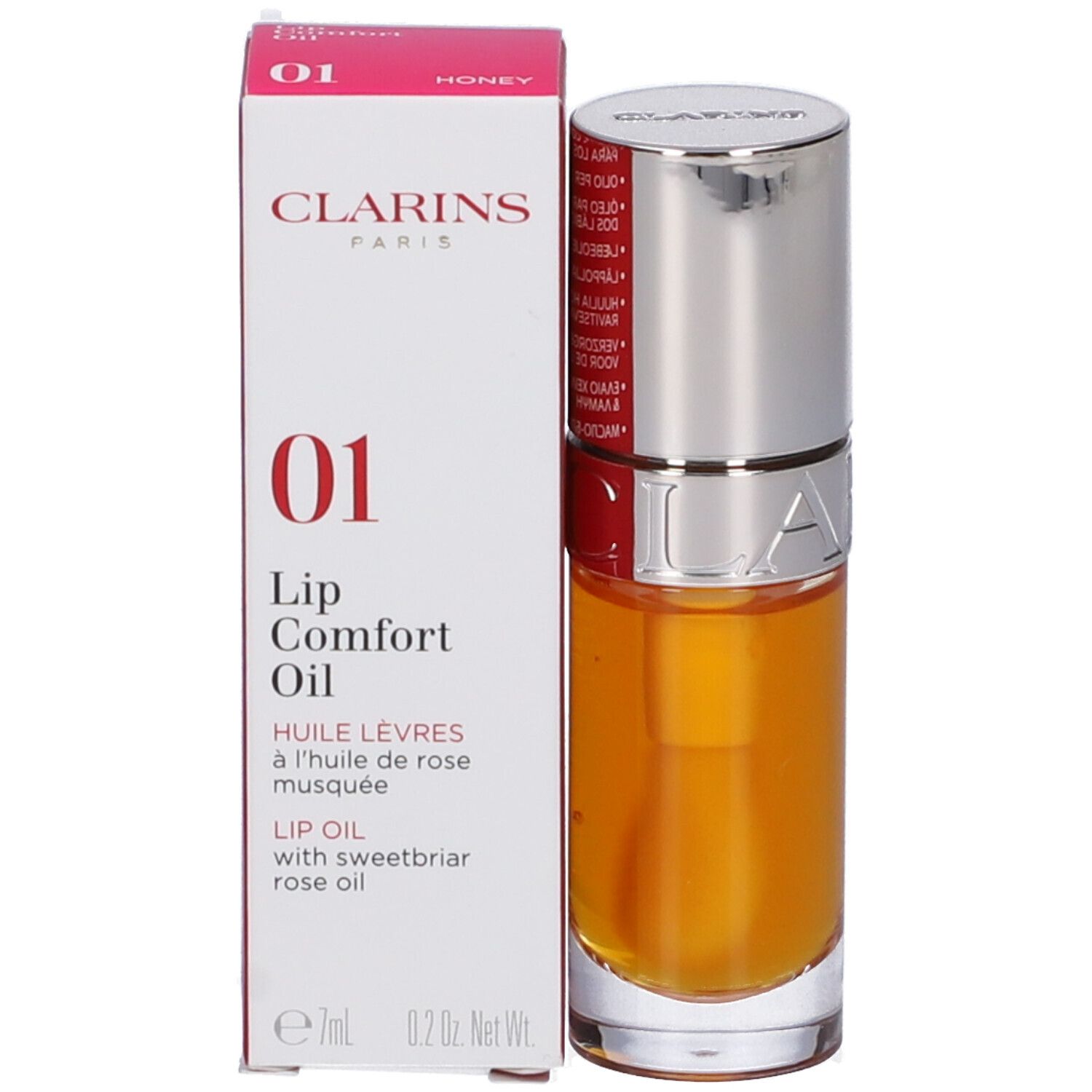Clarins Lip Comfort Oil 01 Honey, con confezione. Bottiglia e scatola con informazioni sul prodotto.