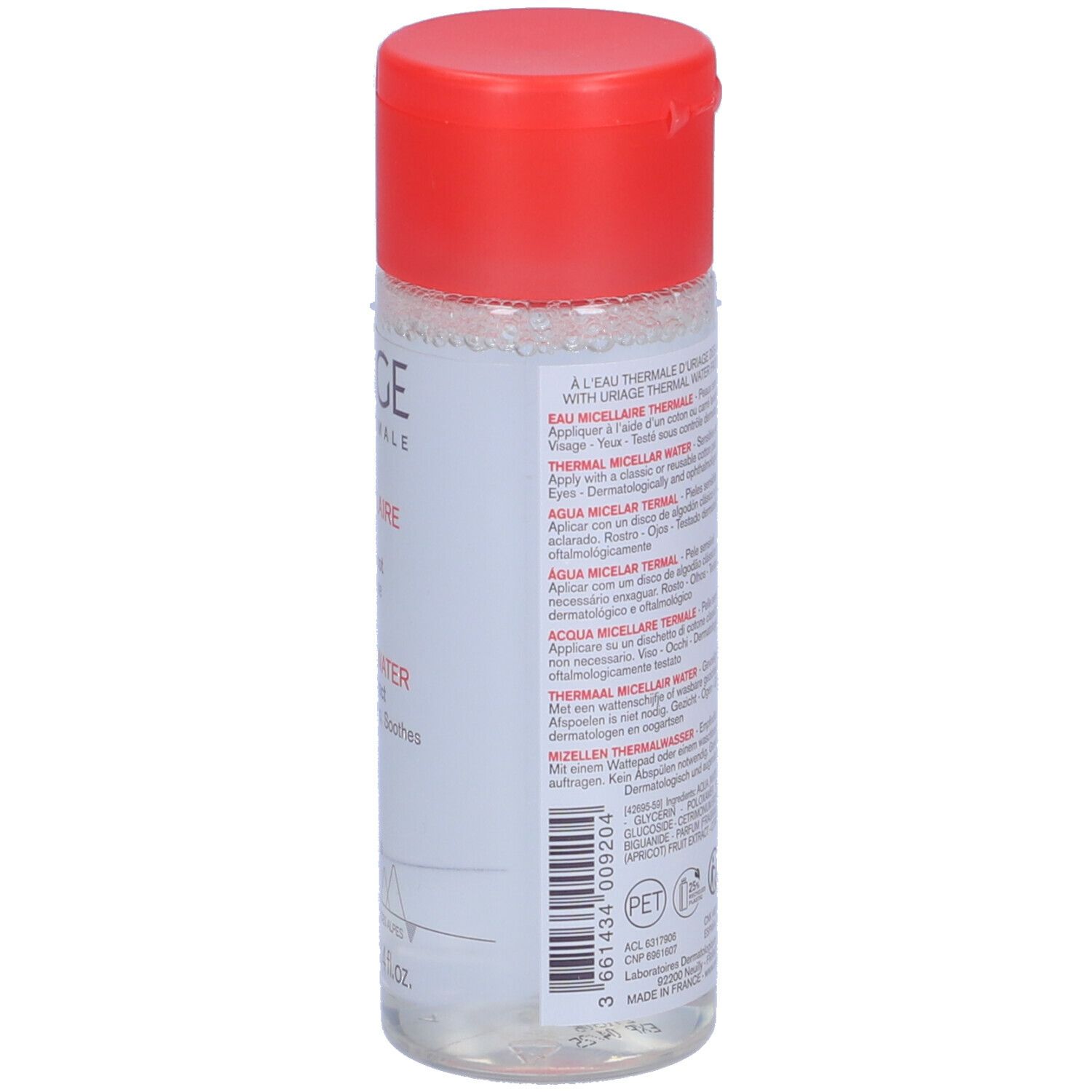 Flacone di Acqua Micellare Termale URIAGE con tappo rosso. Informazioni sul prodotto sul retro. Multilingue.