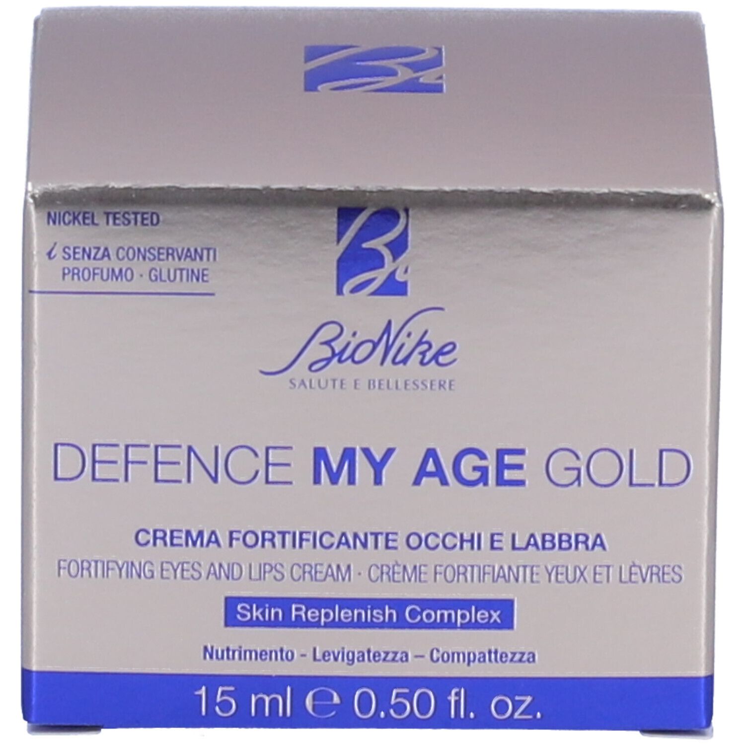 Schachtel. Aufschrift: Defence My Age Gold. 15 ml e 0.50 fl. oz. Für Augen und Lippen. Nickel getestet. Ohne Konservierungsstoffe.