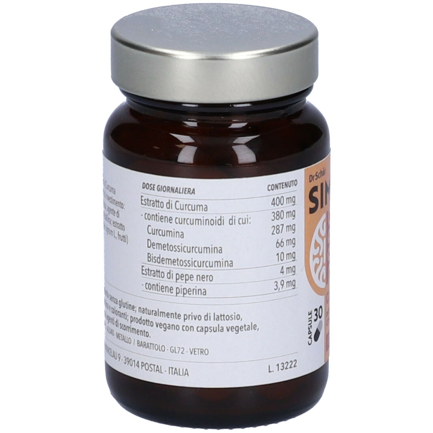 Retro di un flacone di vetro marrone con capsule. Etichetta con ingredienti e dosaggio. Contiene curcuma e piperina.