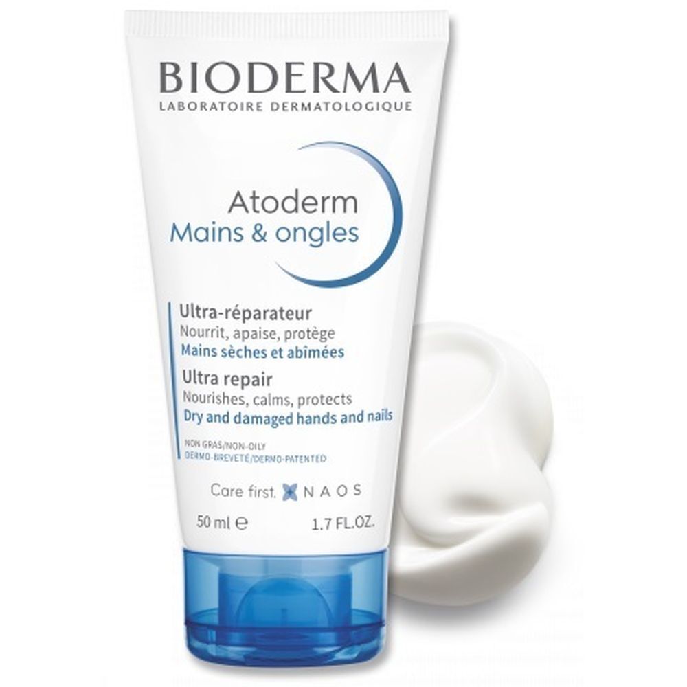 Tubo bianco e blu. Scritta: BIODERMA, Atoderm Mains & Ongles. Testo: Ultra-réparateur, 50 ml. Crema.