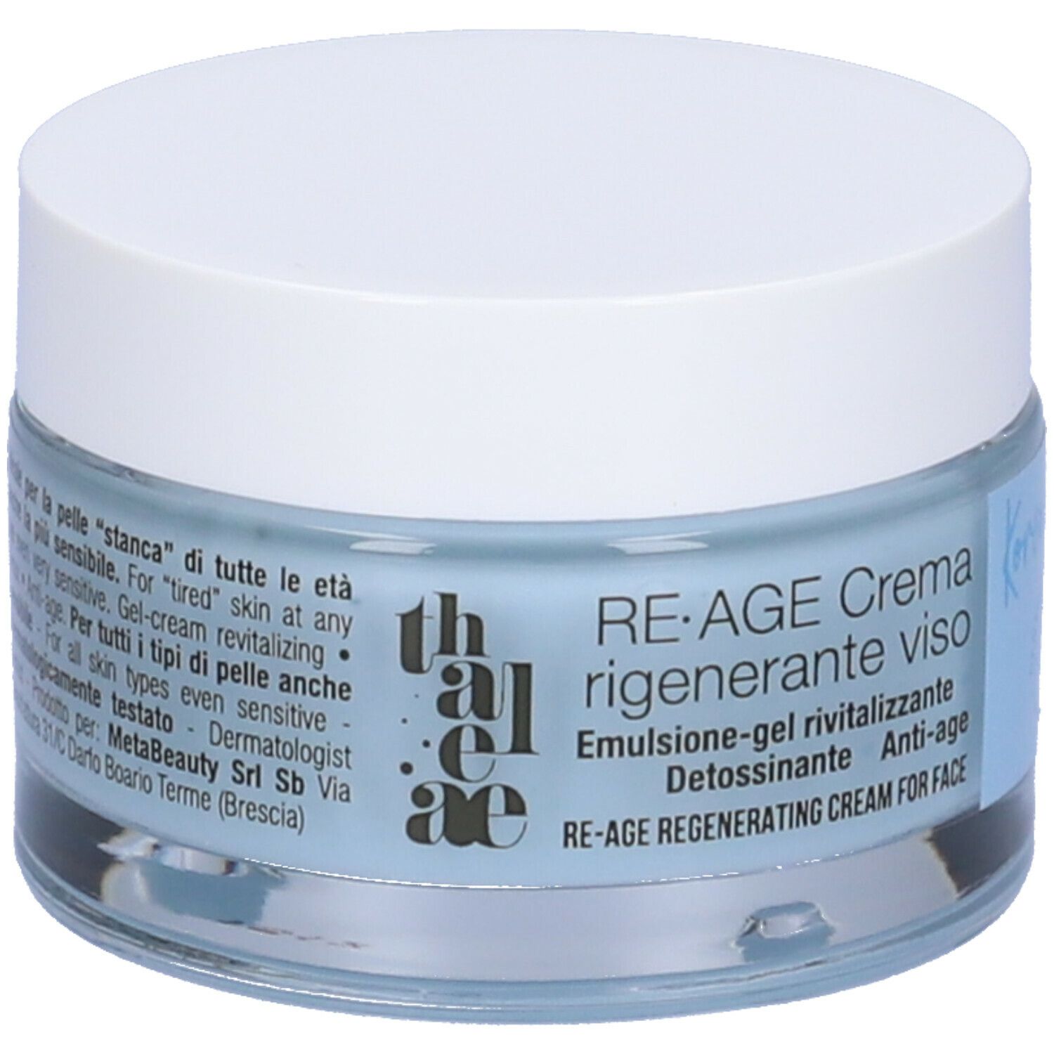 Vasetto di crema con coperchio bianco. L'etichetta dice: RE-AGE Crema rigenerante viso. Liquido blu visibile.