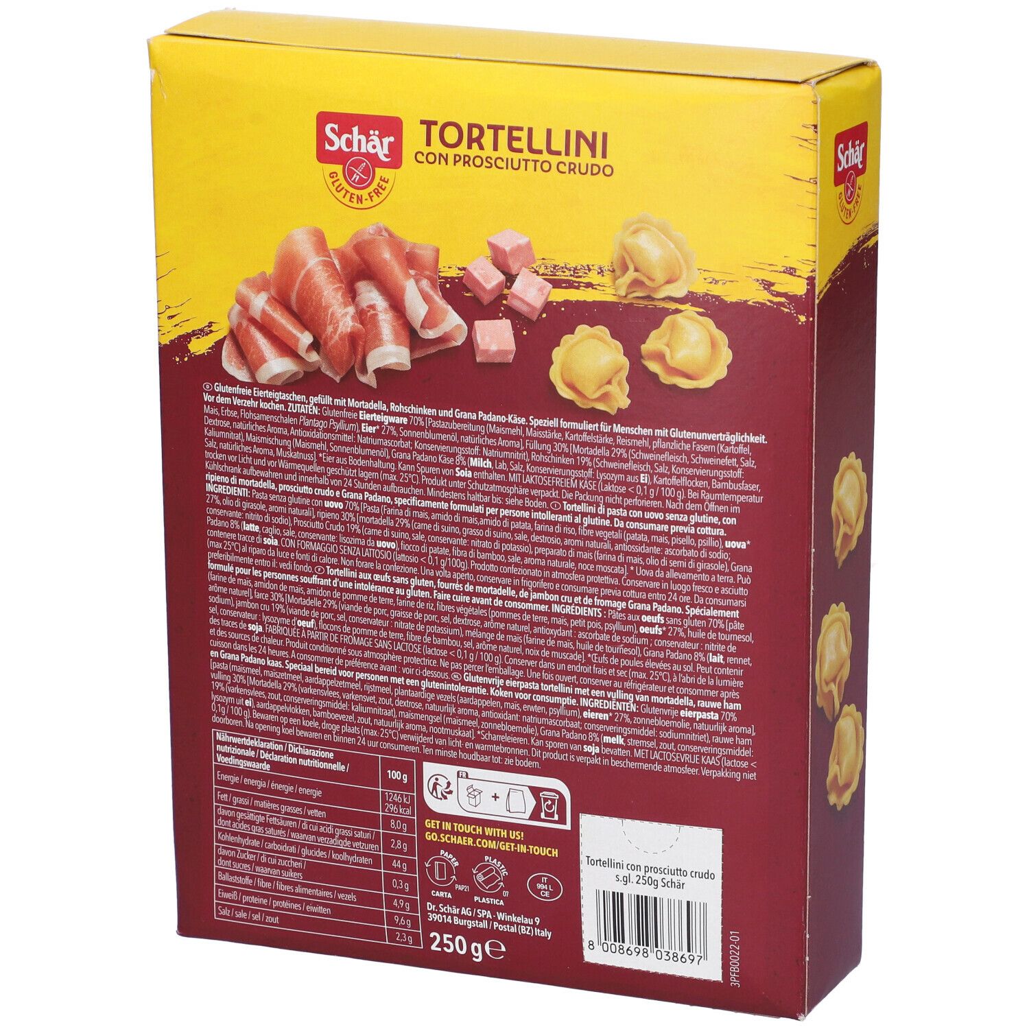 Scatola gialla di tortellini. Scritto: Schar, senza glutine, Tortellini con Prosciutto Crudo, 2 porzioni, 3-4 min. Retro con ingredienti e valori nutrizionali.